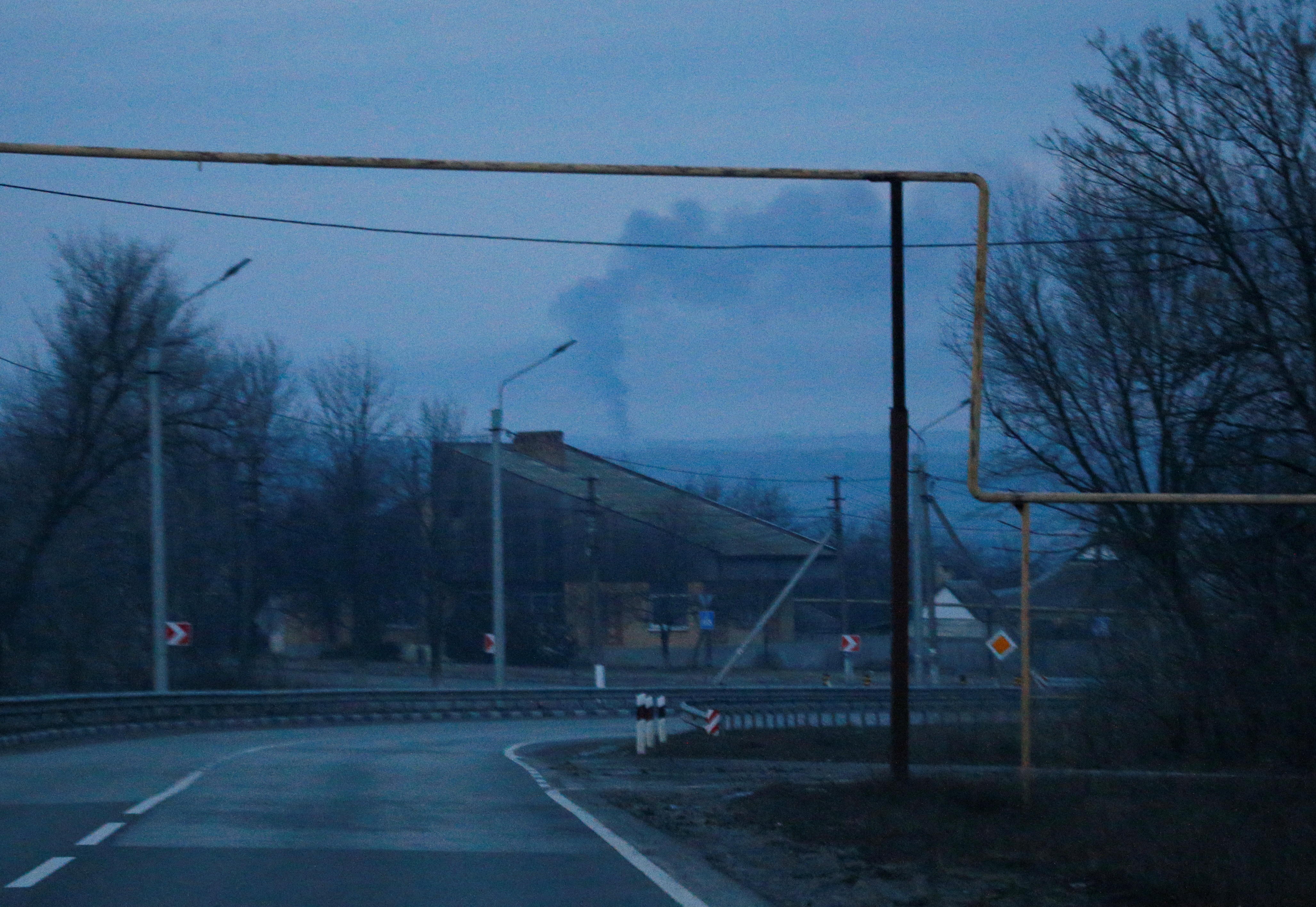 Smoke rises over the area near the town of Chasiv Yar in the Donetsk region, Ukraine February 24, 2022. REUTERS/Gleb Garanich