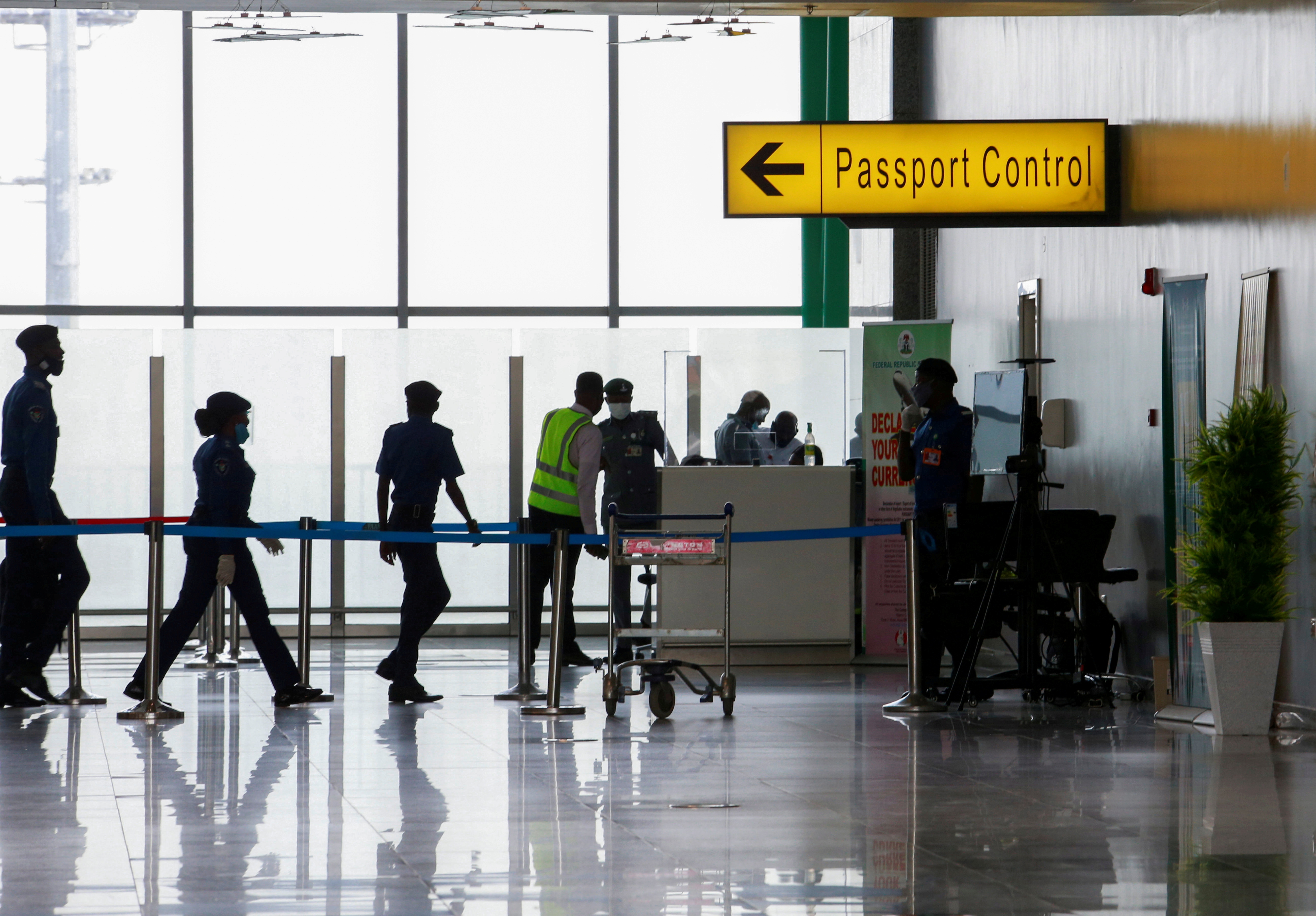 Security officers are seen at the passport control point at the Nnamdi Azikiwe international airport in Abuja