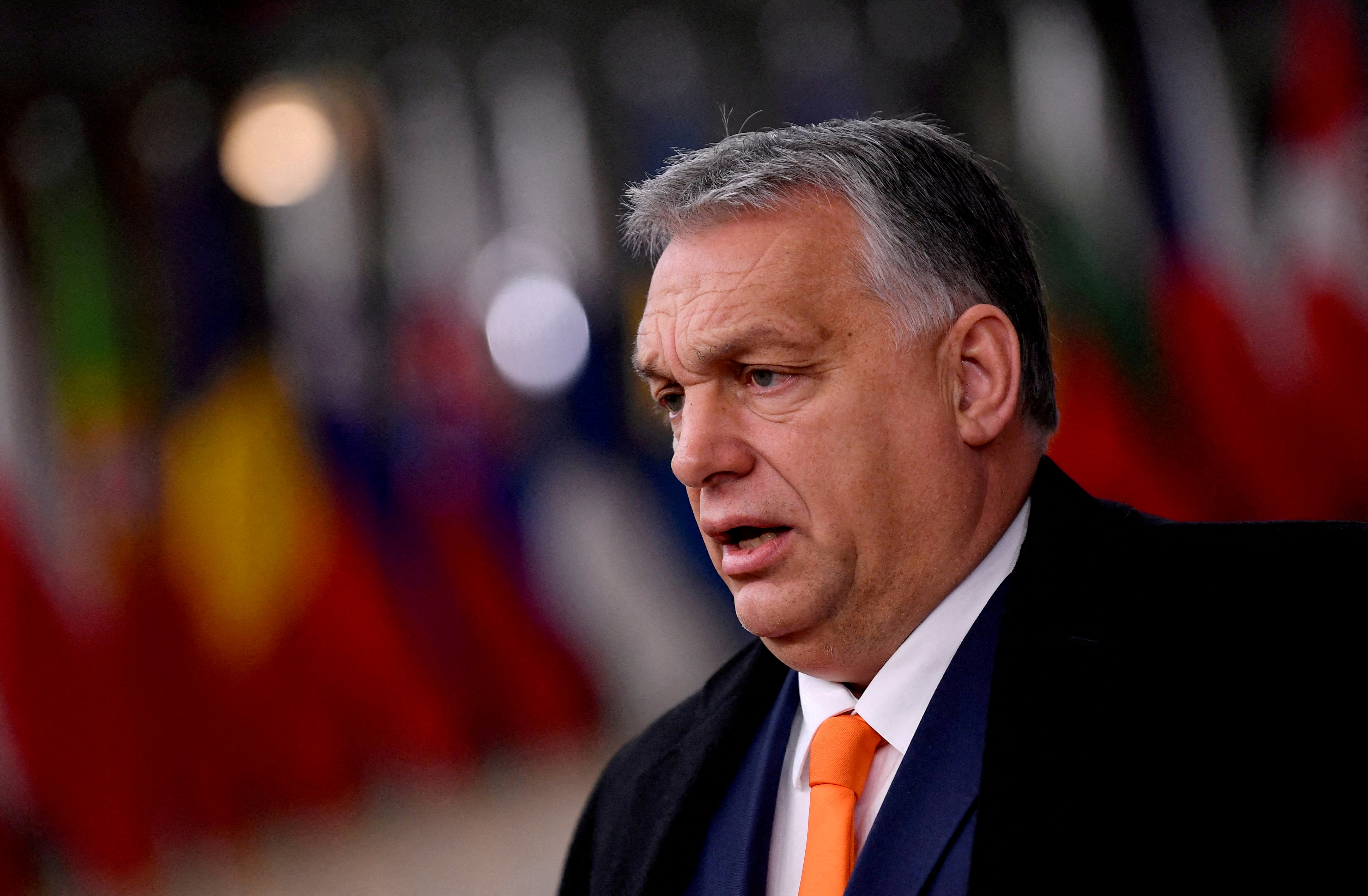 Hungarian Prime Minister Viktor Orban speaks on arrival for an EU summit in Brussels