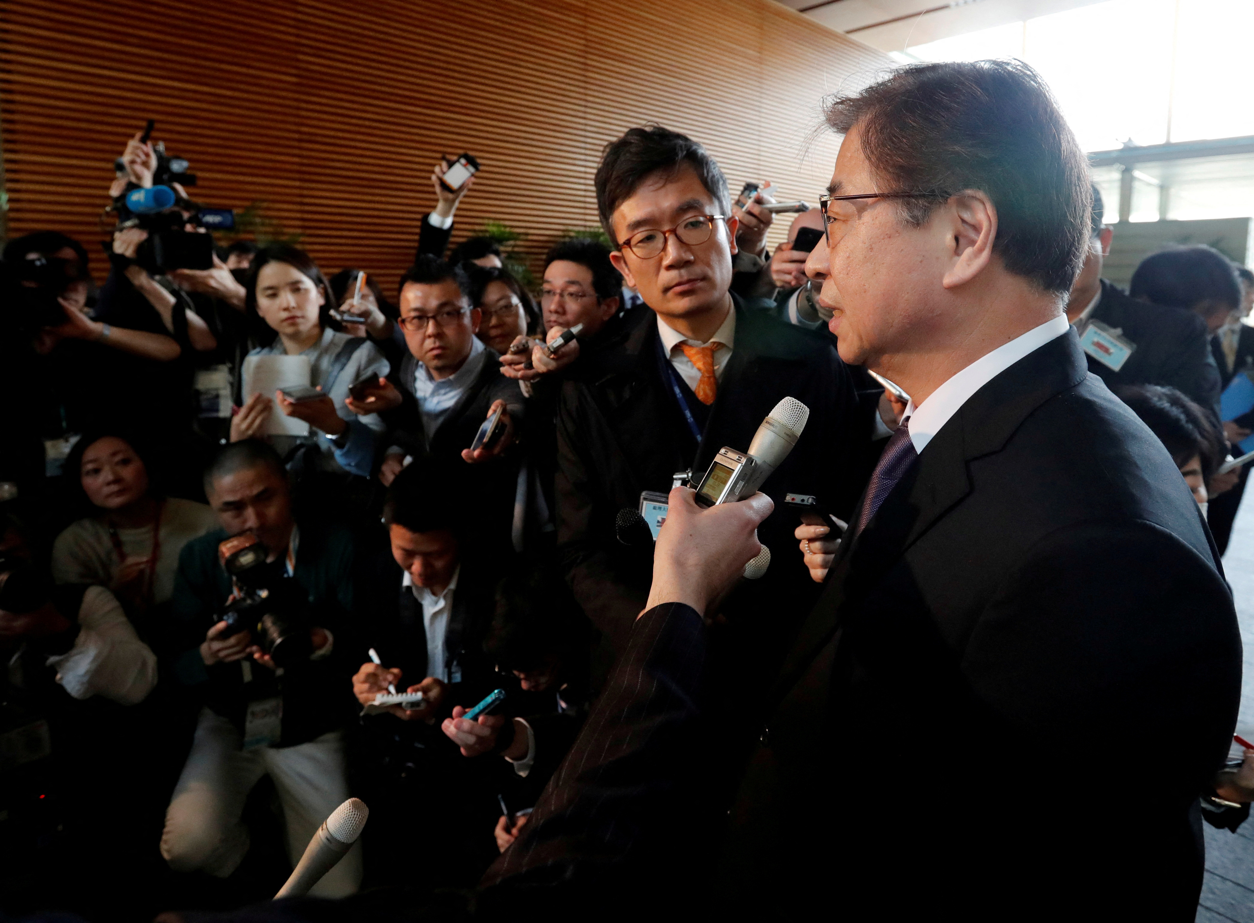 South Korea's National Intelligence Service chief Suh Hoon talks to reporters after meeting with Japan's Prime Minister Shinzo Abe in Tokyo