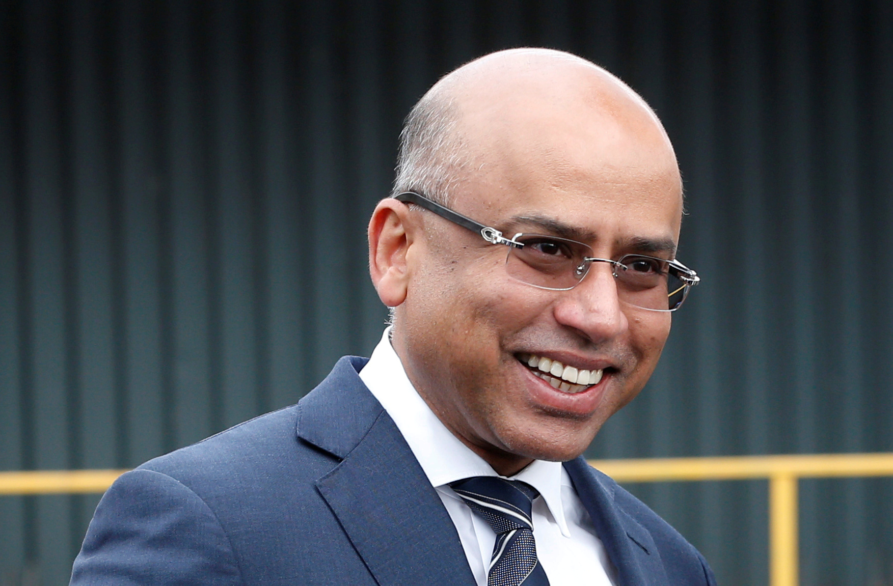 Liberty Steel's Sanjeev Gupta smiles outside their newly acquired Liberty Steel processing mill in Dalzell, Scotland, Britain April 8, 2016. REUTERS/Russell Cheyne/File Photo