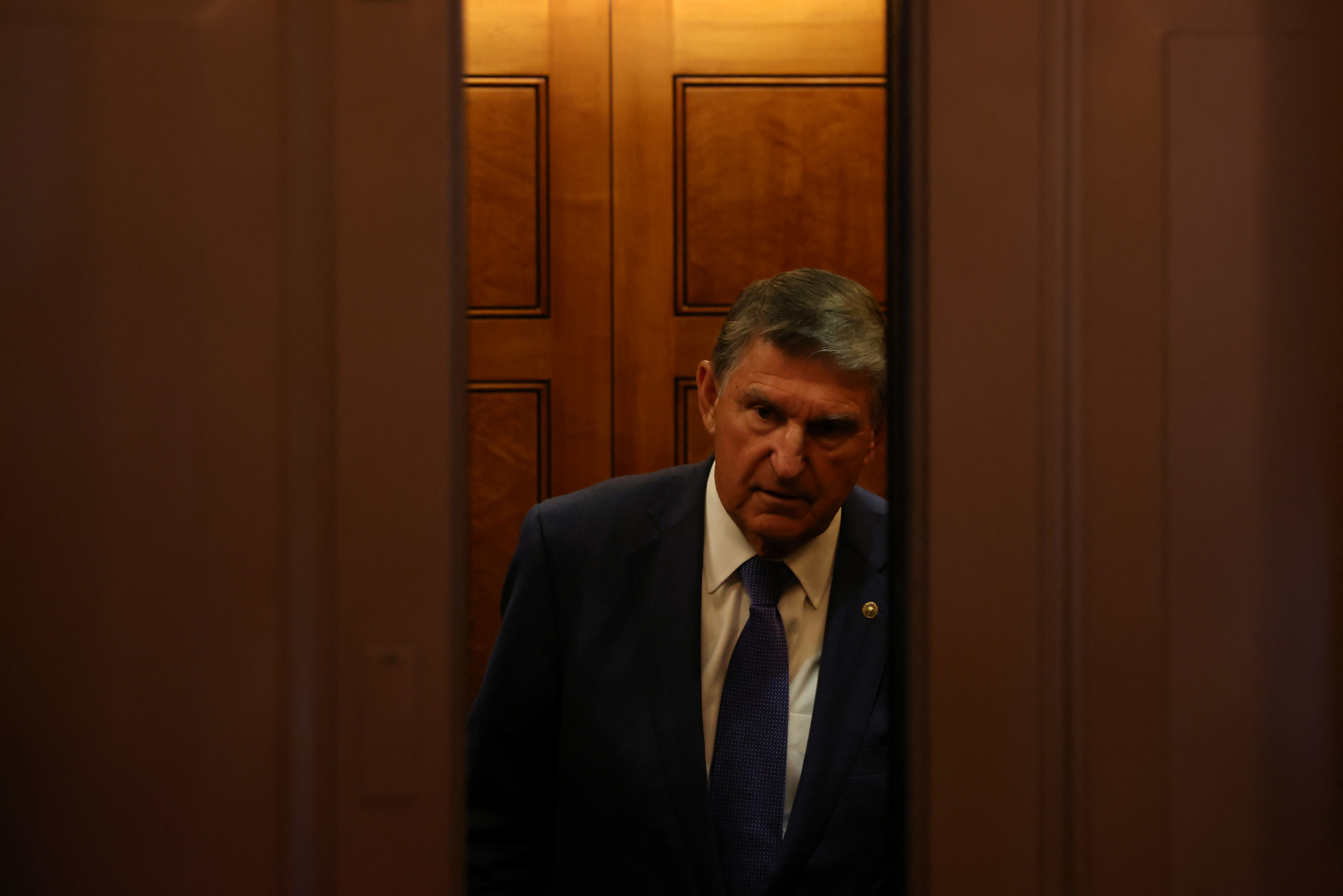 U.S. Senator Joe Manchin leaves the Senate floor in Washington