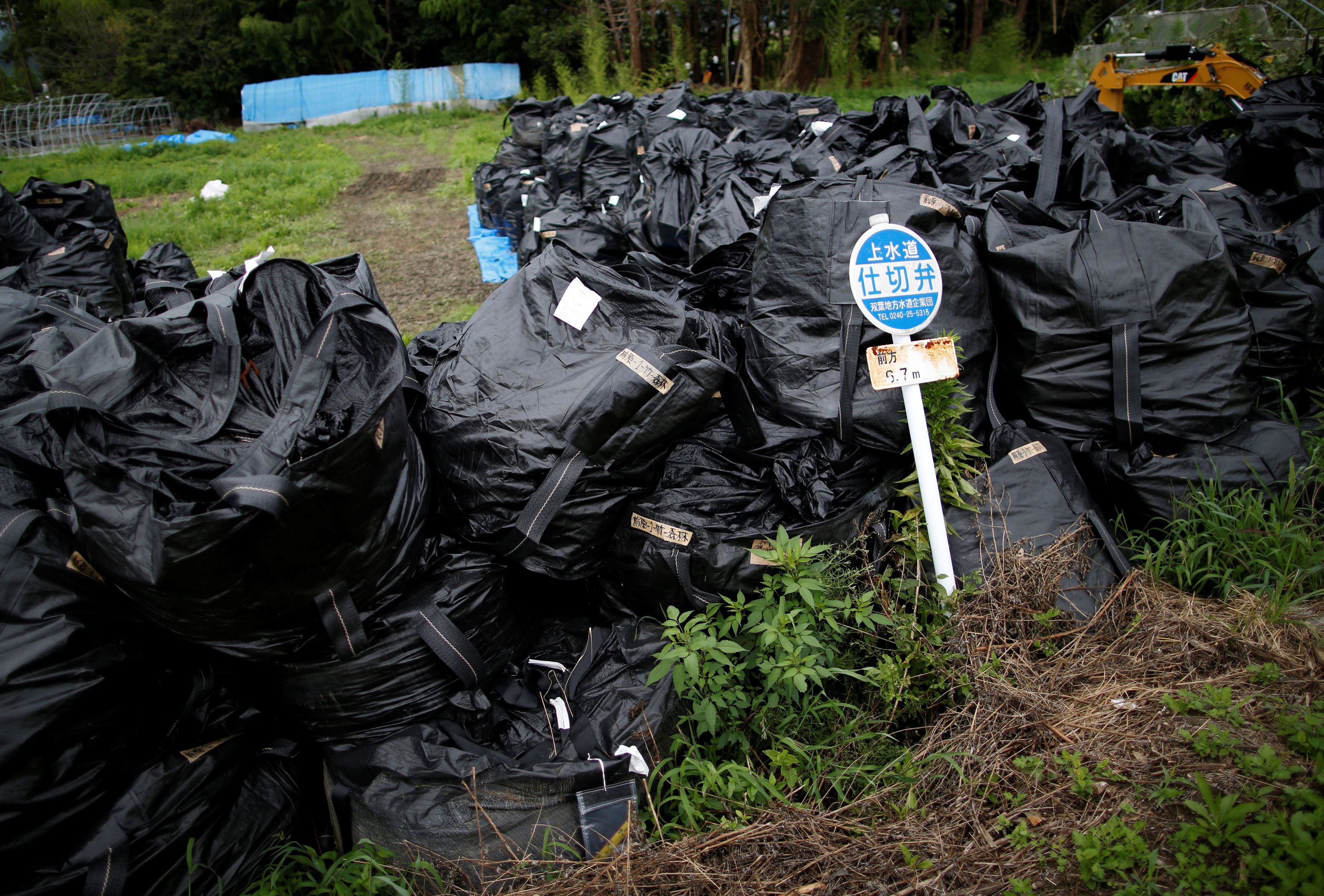 Waste containing irradiated soil, leaves and debris from the decontamination operation are collected in Naraha town, Fukushima prefecture
