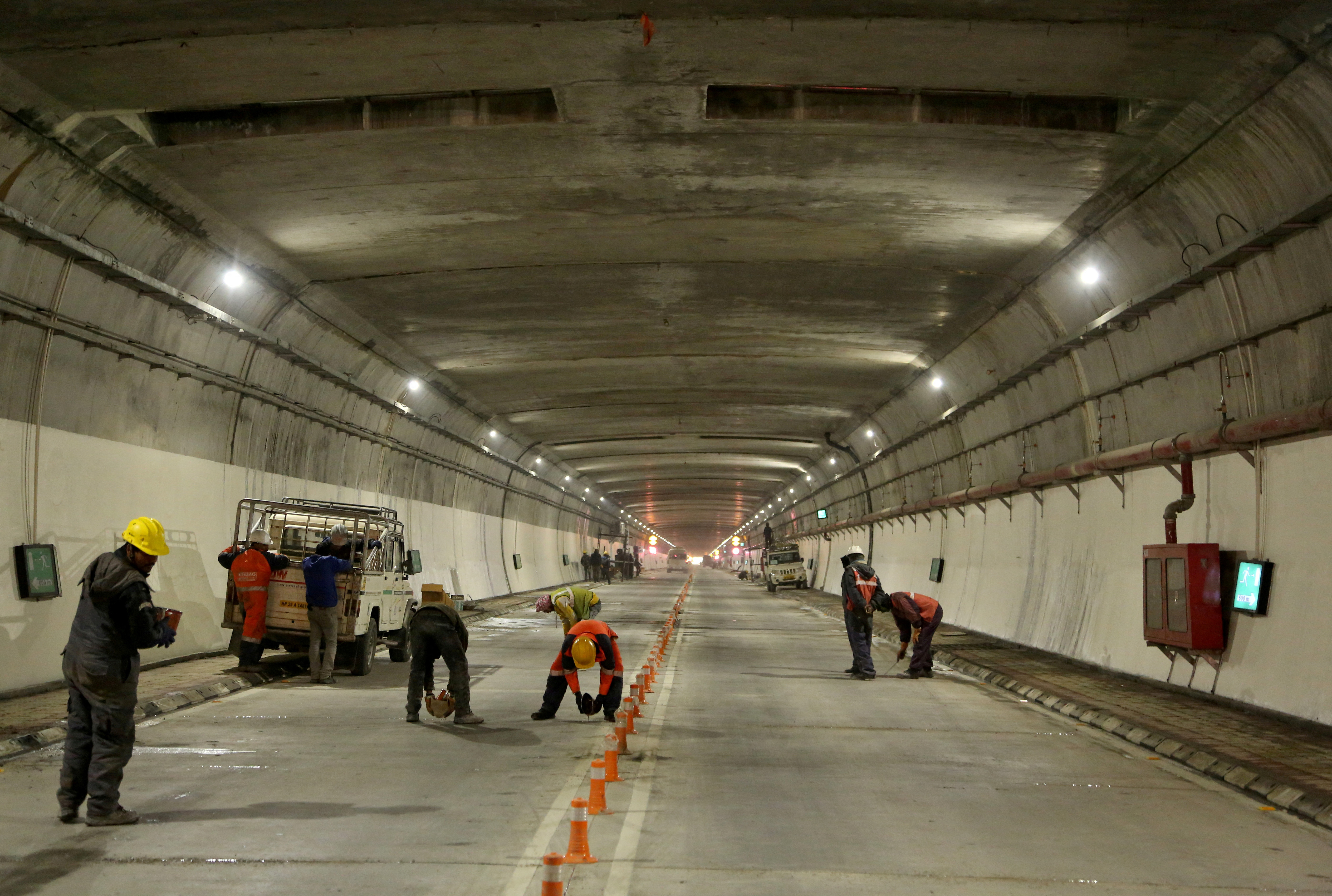 Labourers work inside the newly constructed Atal Tunnel on the Leh-Manali highway