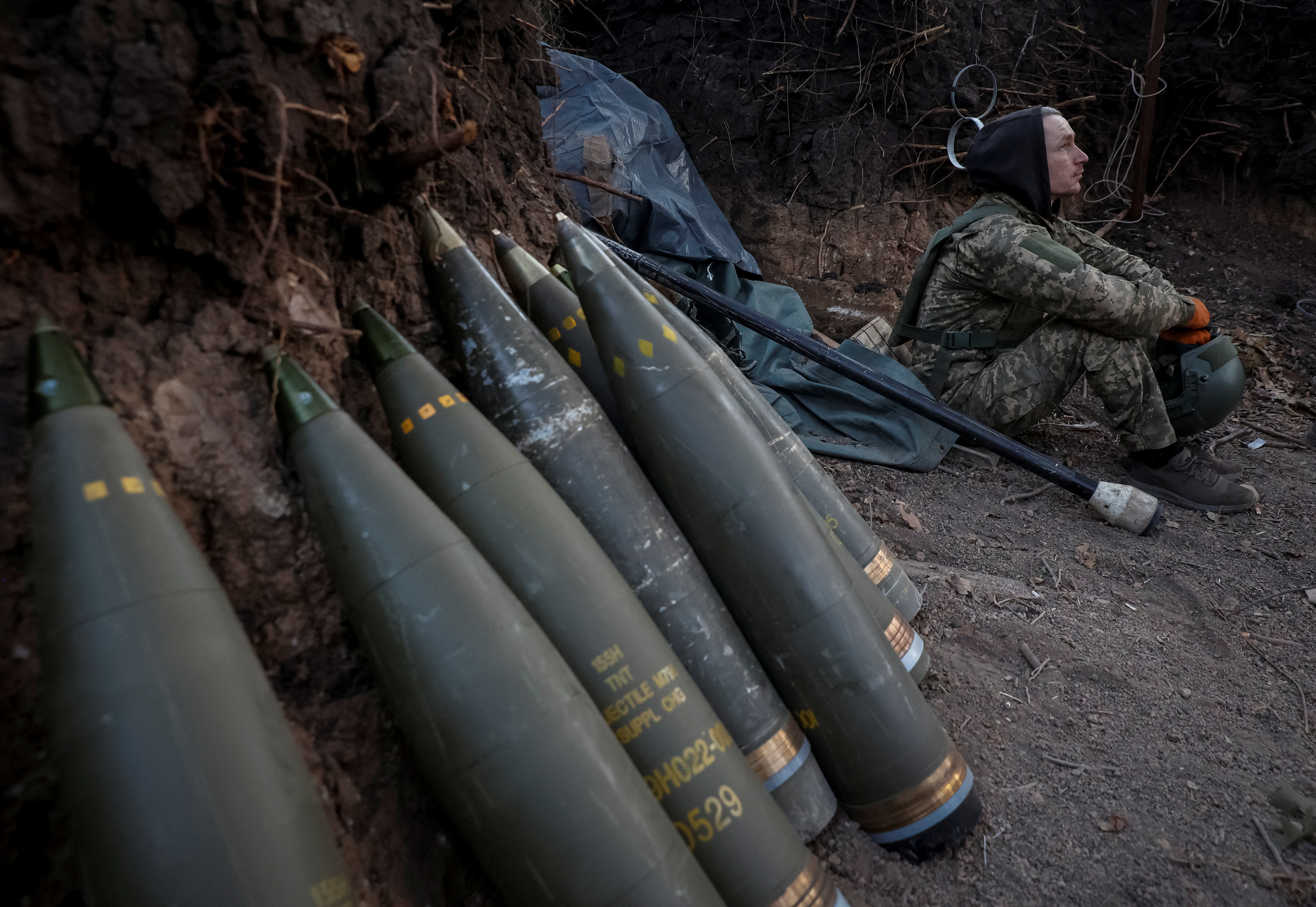 Ukrainian serviceman prepares a howitzer to fire towards Russian troops in Donetsk region