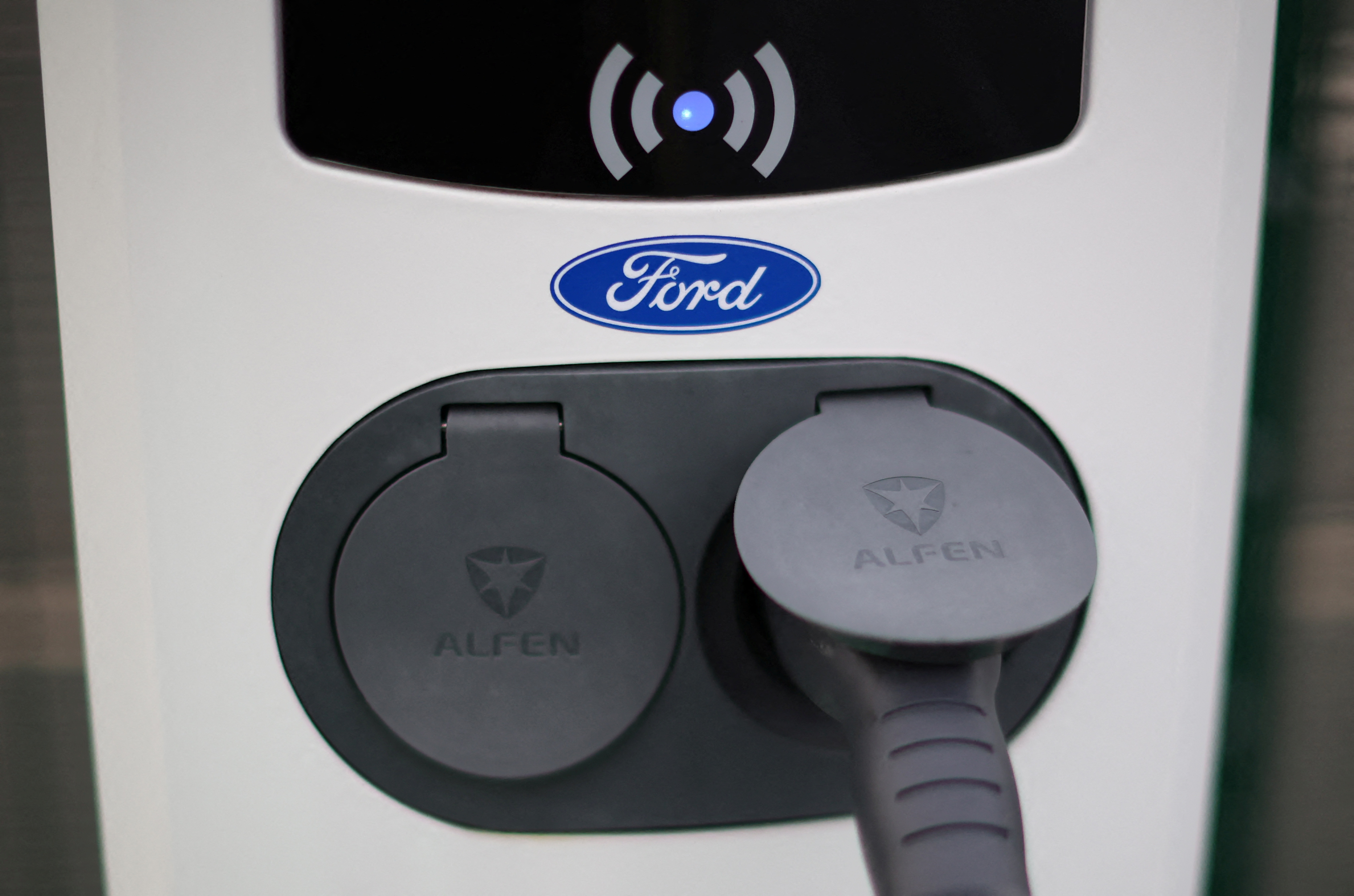 A Ford logo is seen on an electric vehicle charging point during a press event at the Ford Halewood transmissions plant in Liverpool