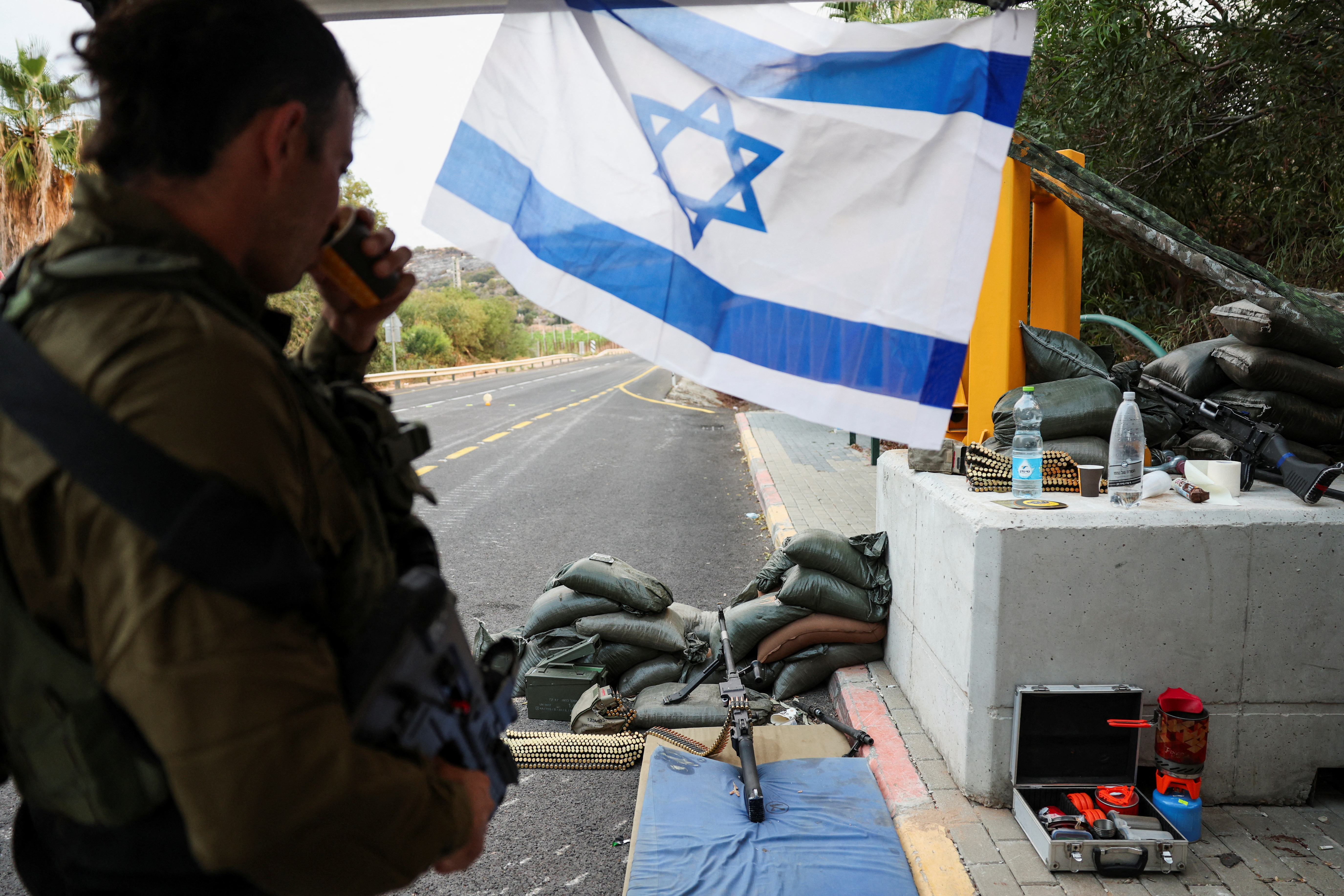 Israeli soldiers man a checkpoint near the border with Lebanon, in northern Israel