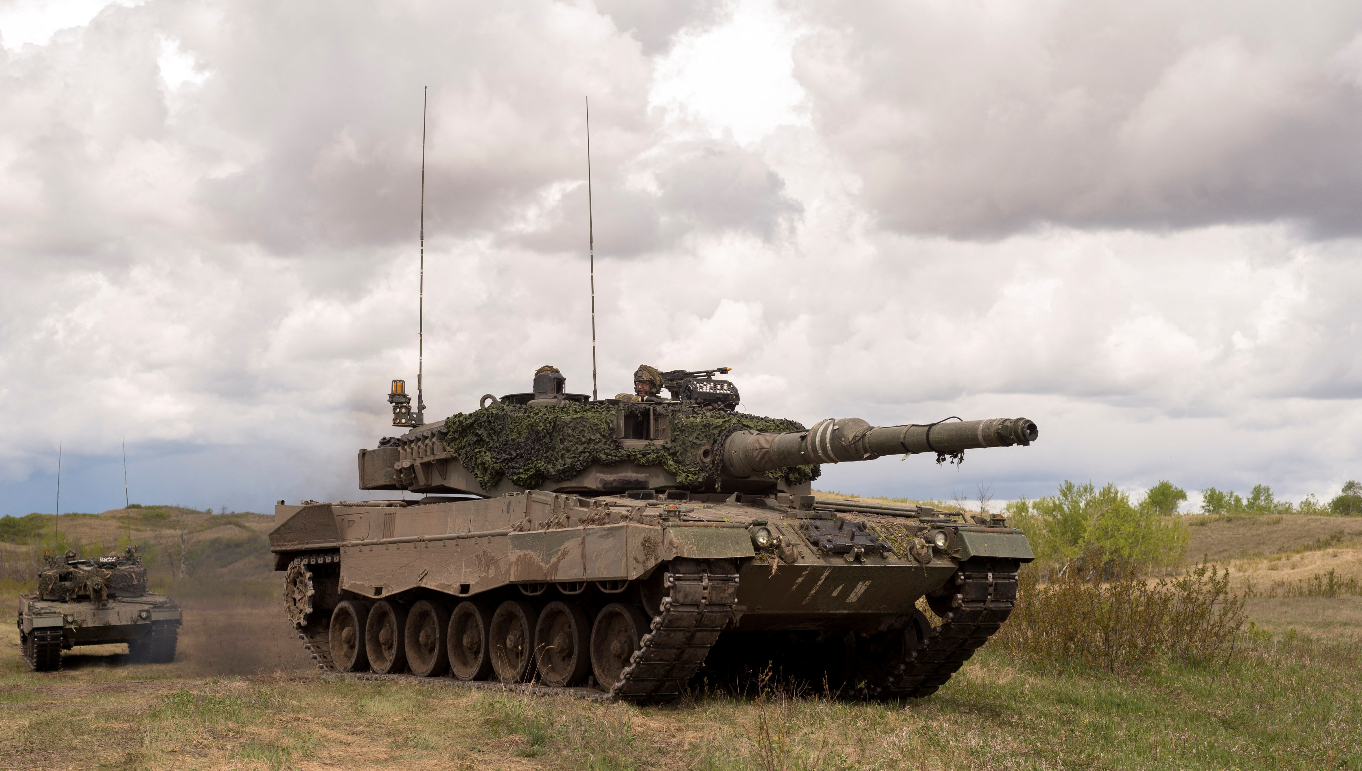 Leopard 2A4 tanks from the Royal Canadian Dragoons C Squadron travel in the Wainwright Garrison training area during Exercise in Wainwright