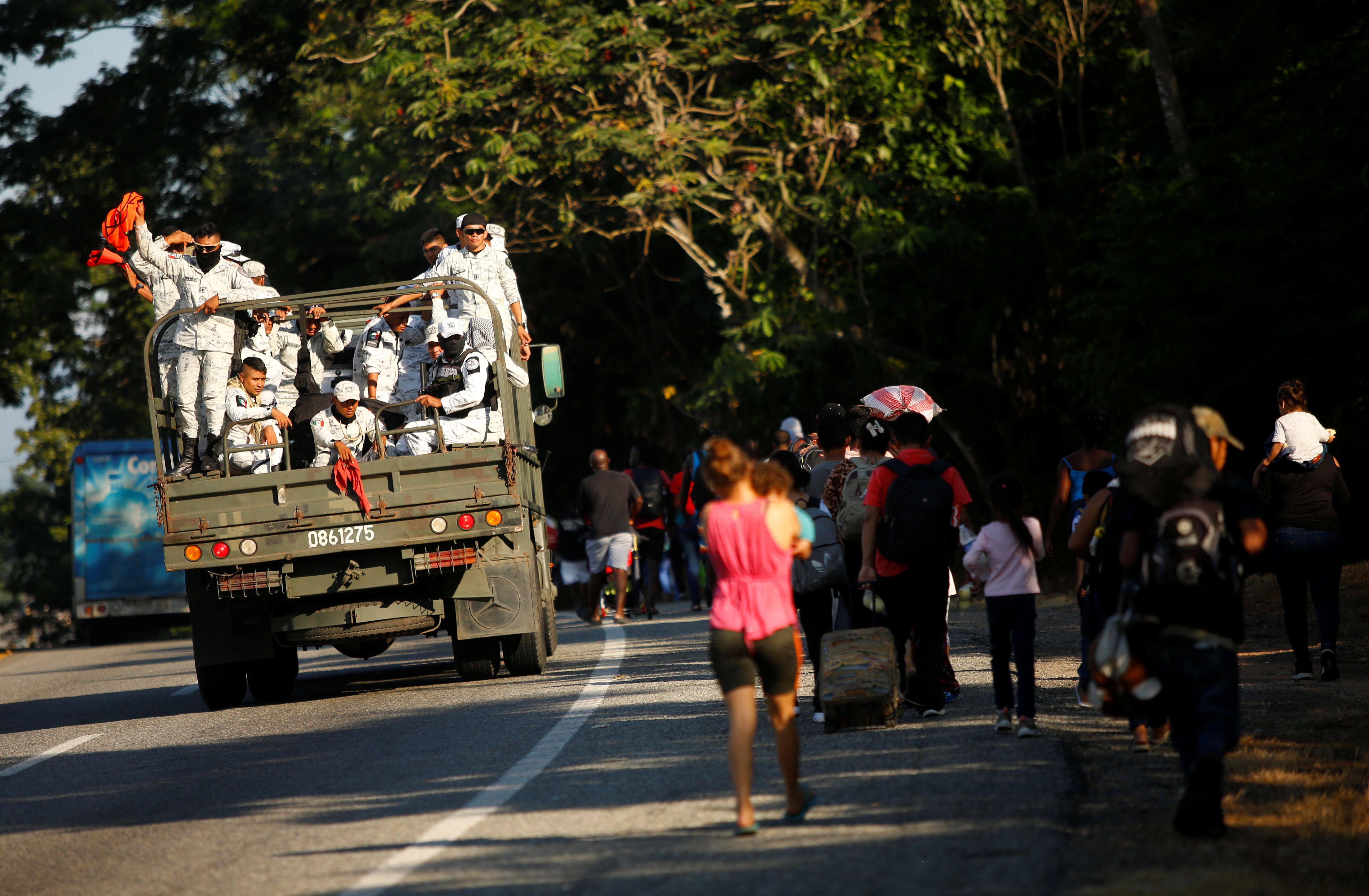 Migrants take part in a caravan heading to the U.S. border, near Tapachula