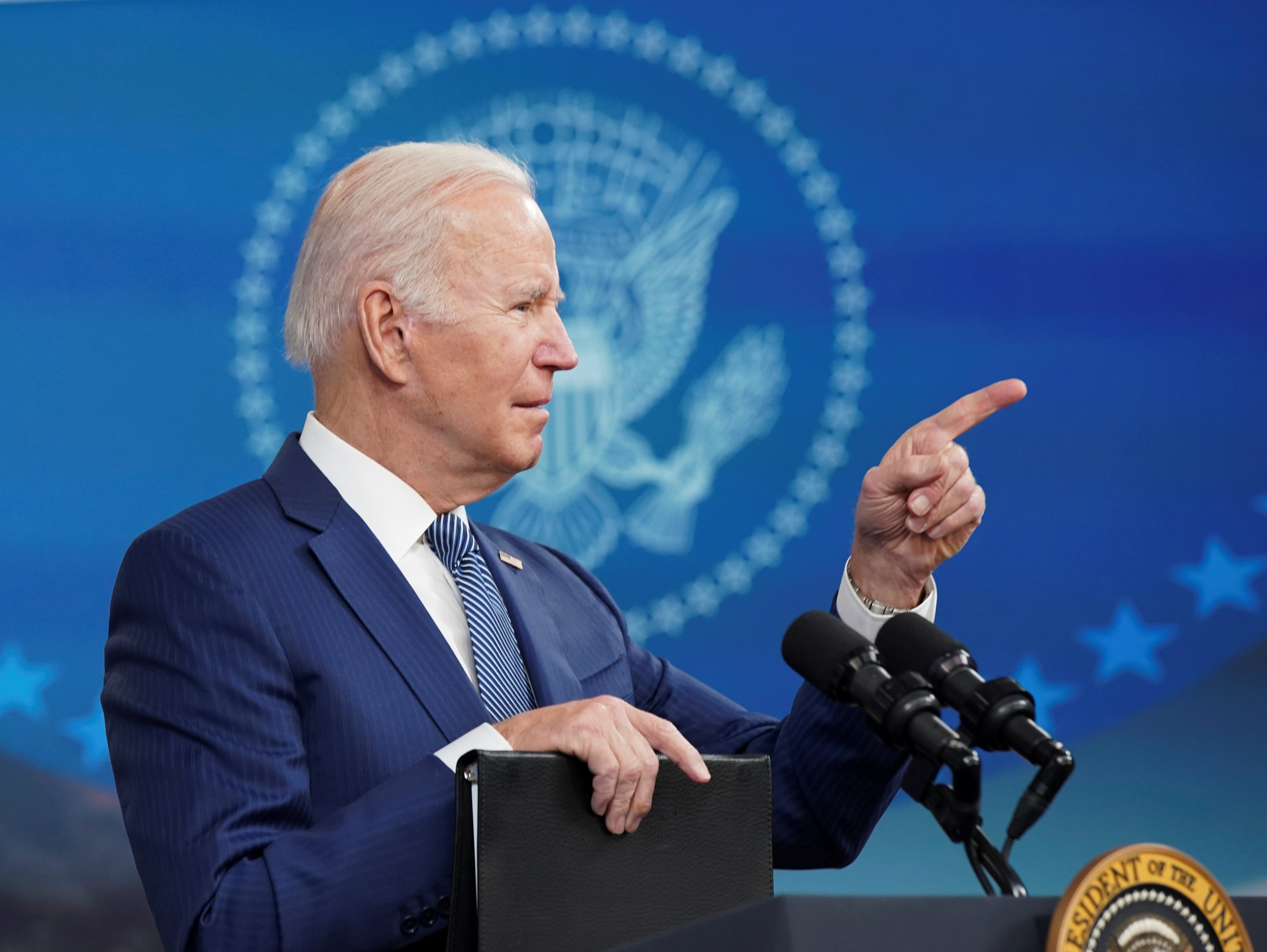 U.S. President Joe Biden points a finger as he speaks about his administration's efforts to ease supply chain issues during the holiday season, at the White House in Washington, U.S., December 1, 2021. REUTERS/Kevin Lamarque