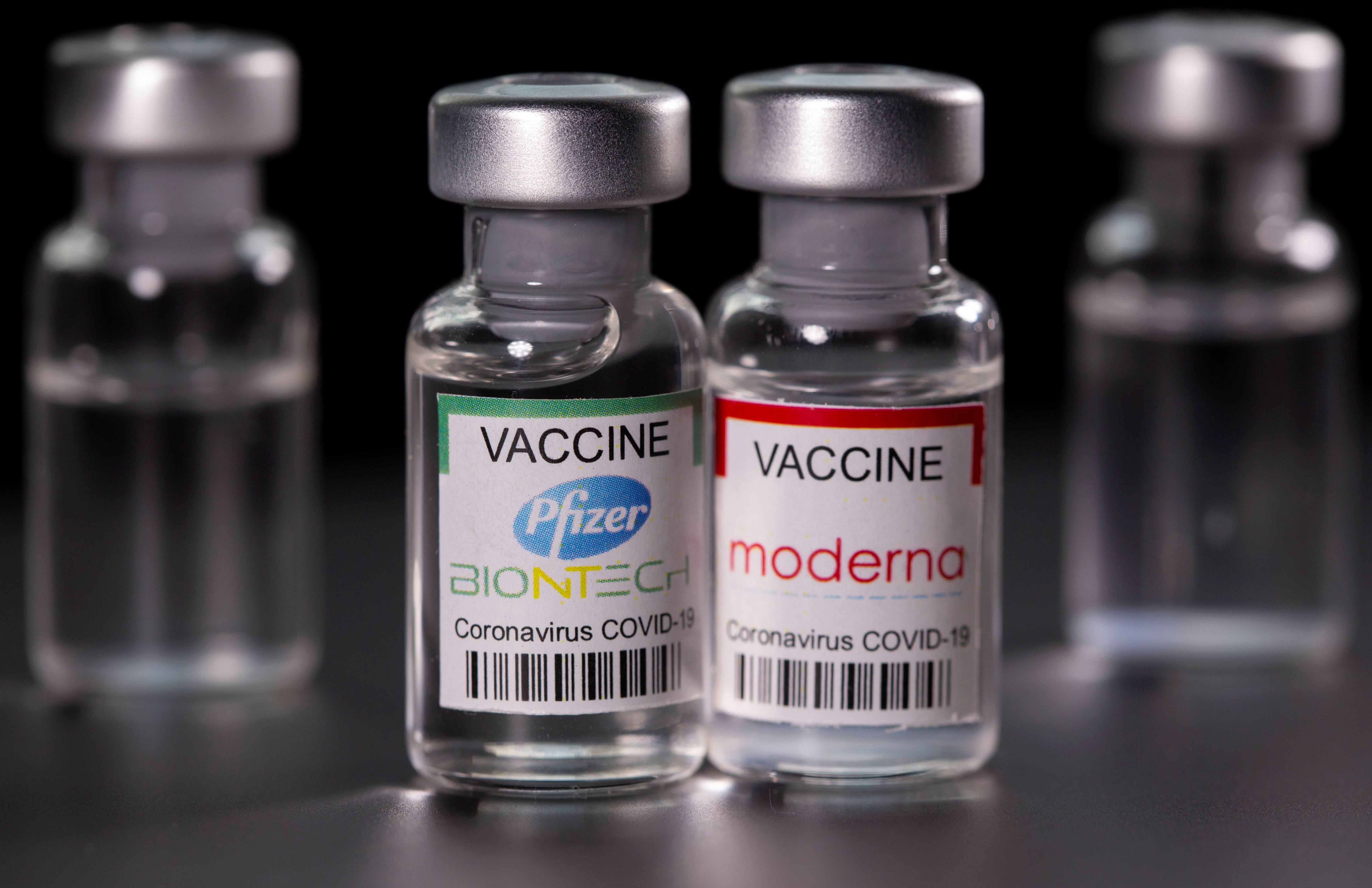Picture illustration of vials with Pfizer-BioNTech and Moderna coronavirus disease (COVID-19) vaccine labels