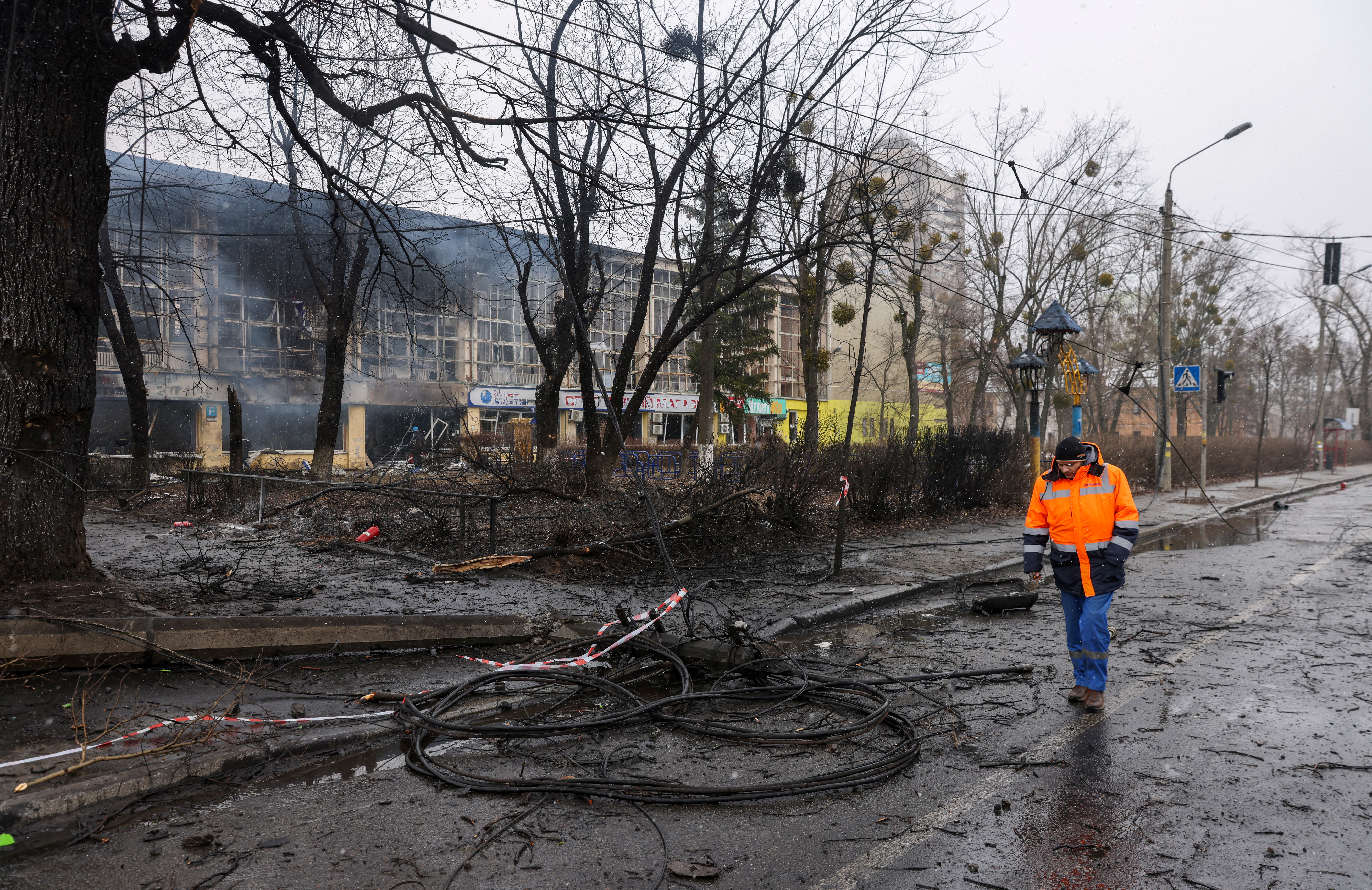 A man walks through yesterday's blast site targeted the TV tower in Kyiv
