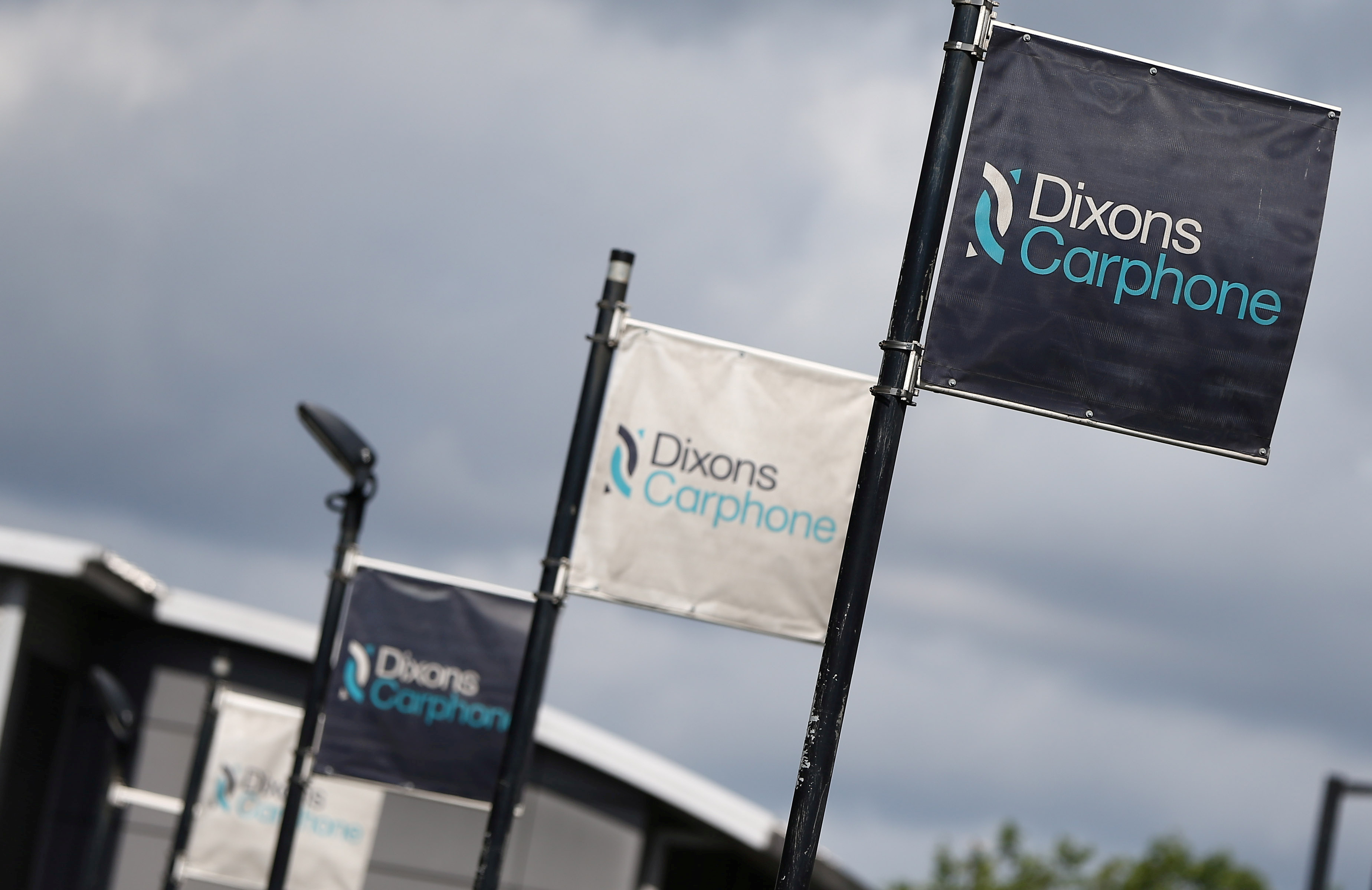 Signs display the logo of Dixons Carphone at the company headquarters in London