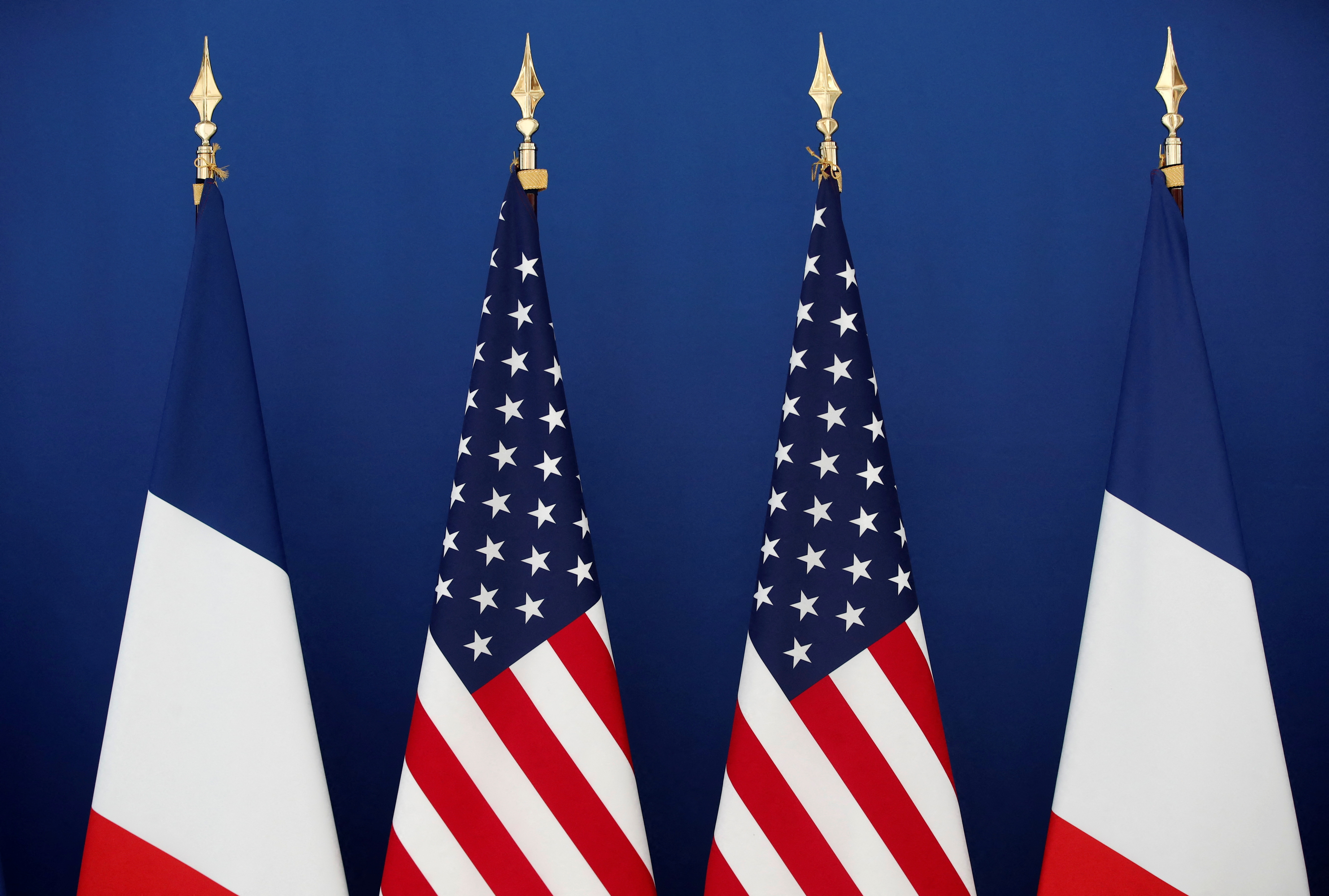 French and U.S. flags are seen ahead of the meeting of French Economy and Finance Minister Bruno Le Maire and US Special Presidential Envoy for Climate John Kerry at the Bercy Finance Ministry in Paris, France, March 10, 2021. REUTERS/Benoit Tessier
