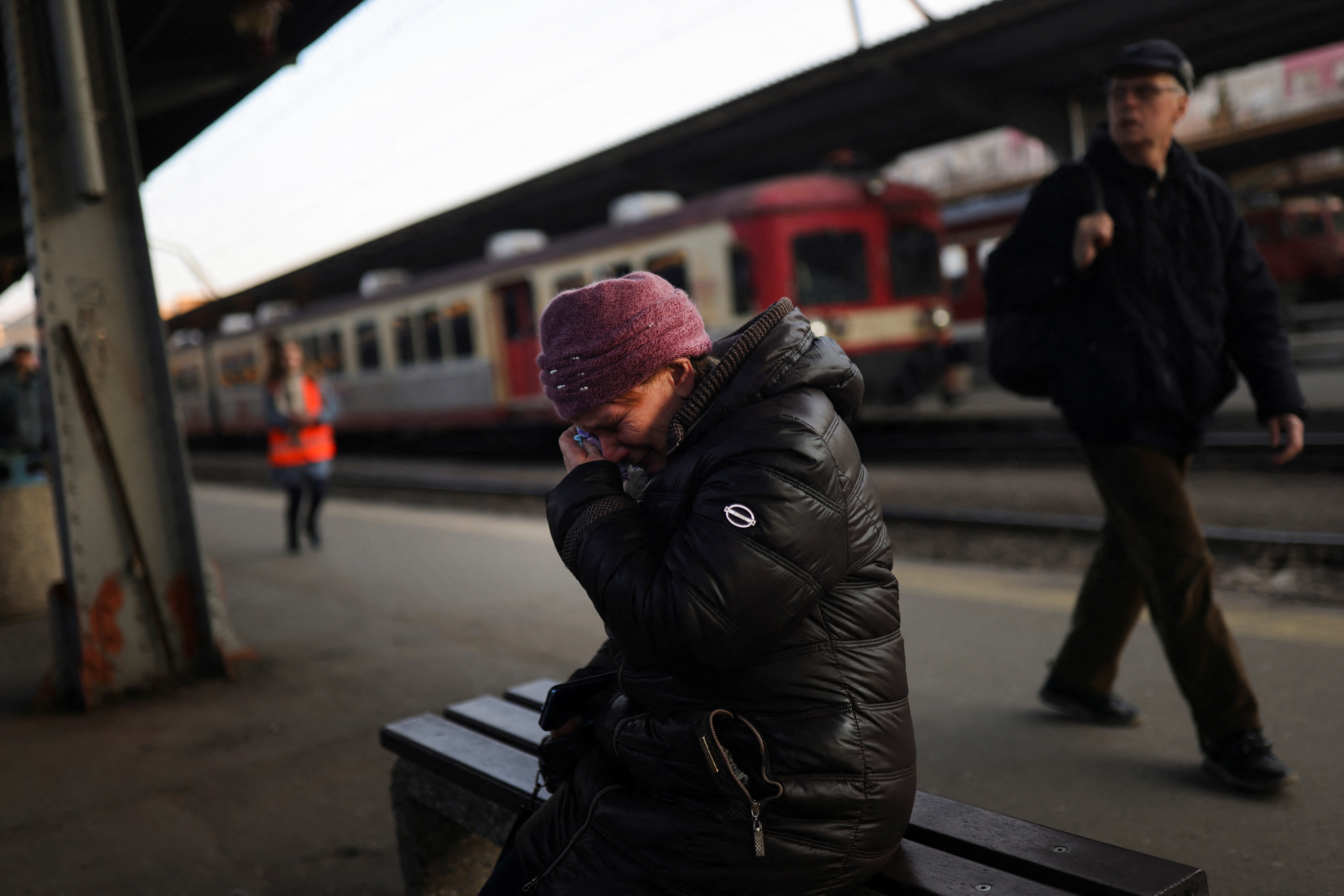 Refugees fleeing Ukraine after the Russian invasion travel in a train to Budapest