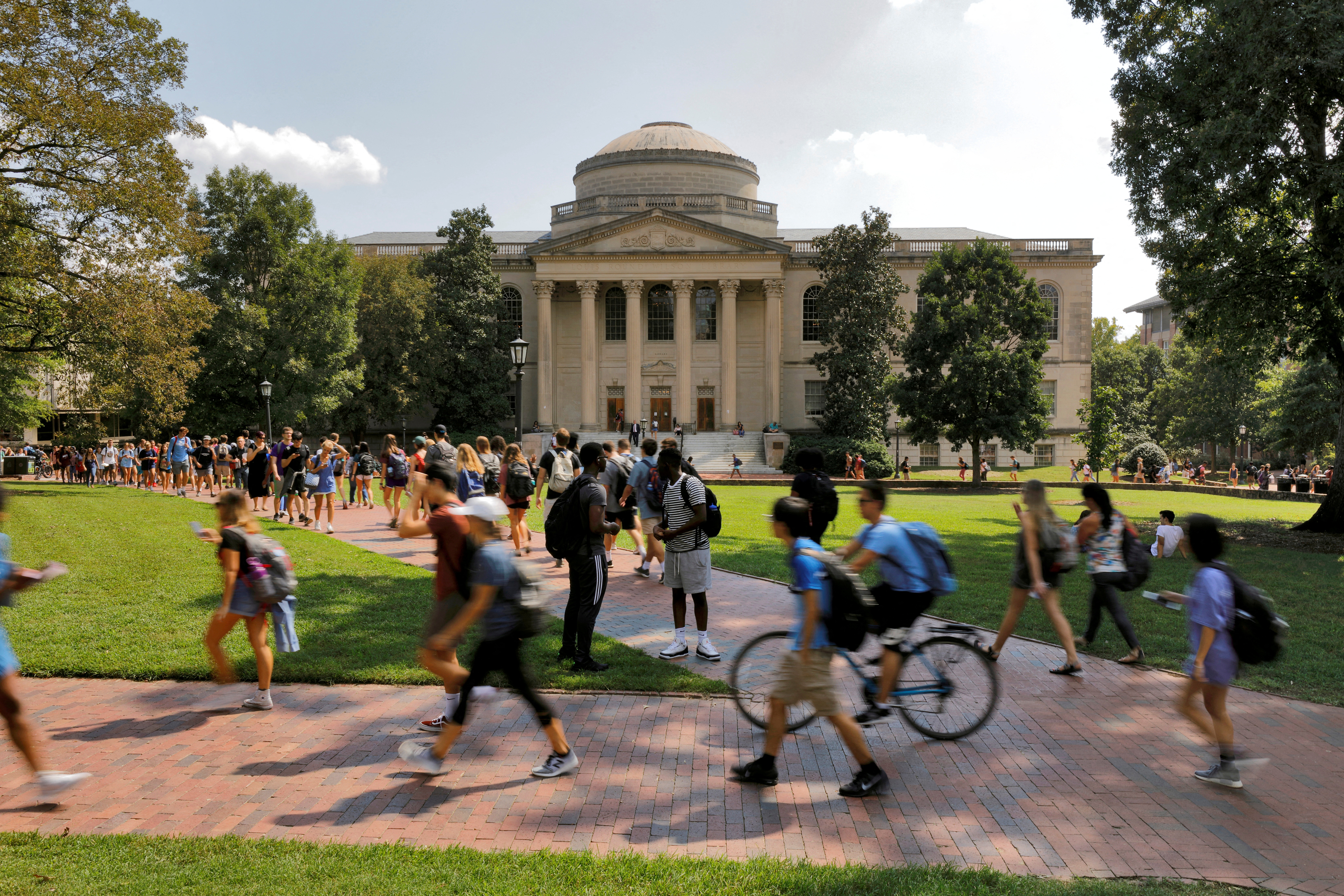Students walk past Wilson Library on the campus of the University of North Carolina at Chapel Hill North Carolina