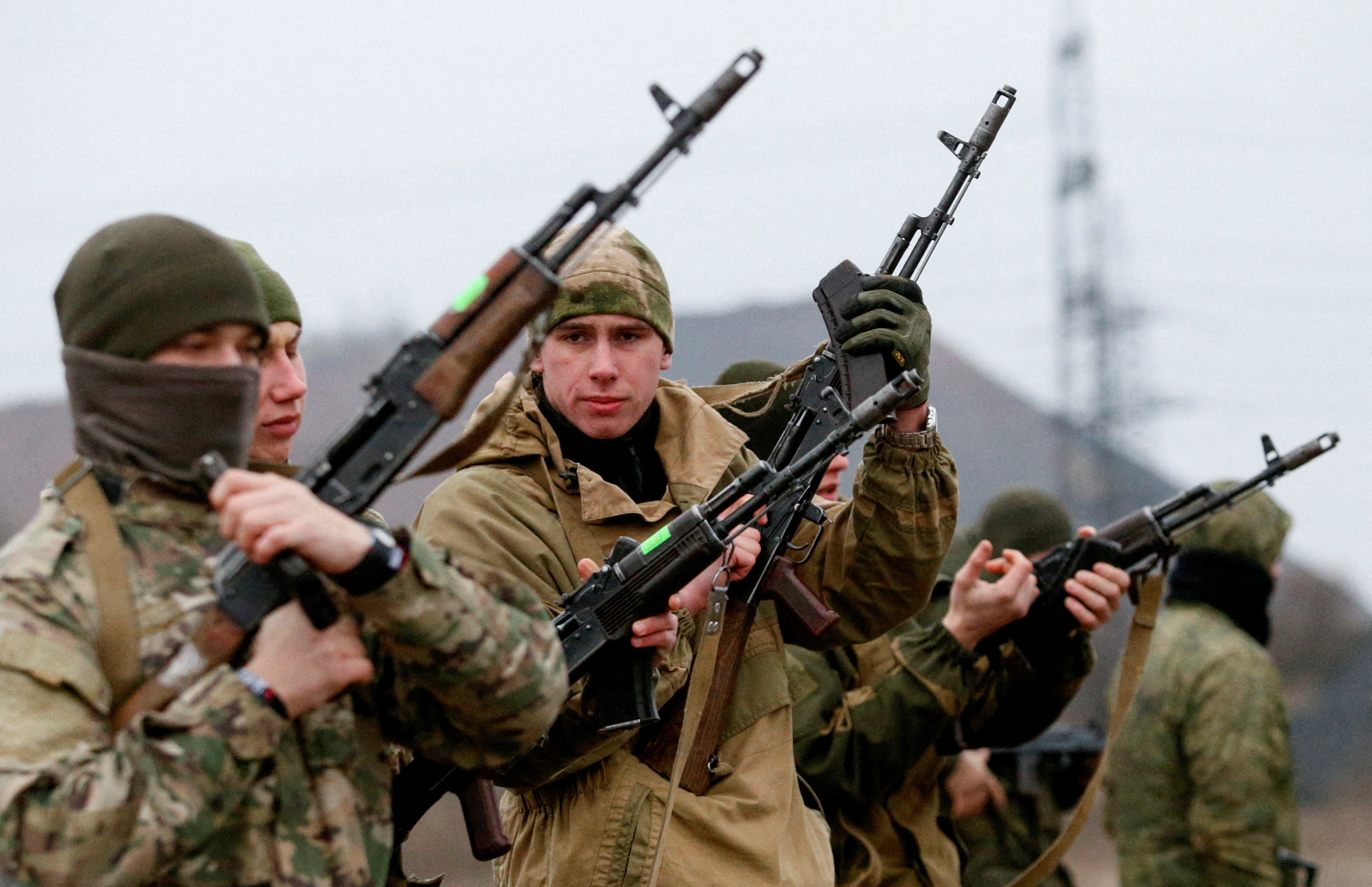 Militants of the self-proclaimed Donetsk People's Republic train at a range in Donetsk