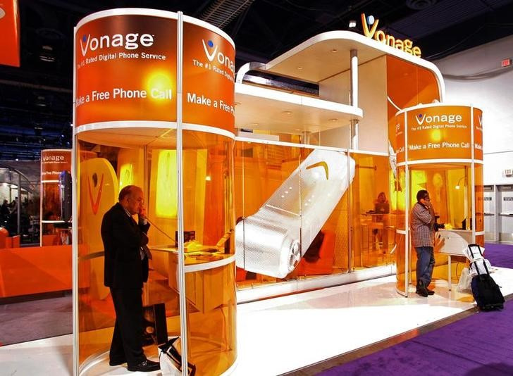Show attendees make free calls at the Vonage booth during the Consumer Electronics Show (CES) in Las Vegas