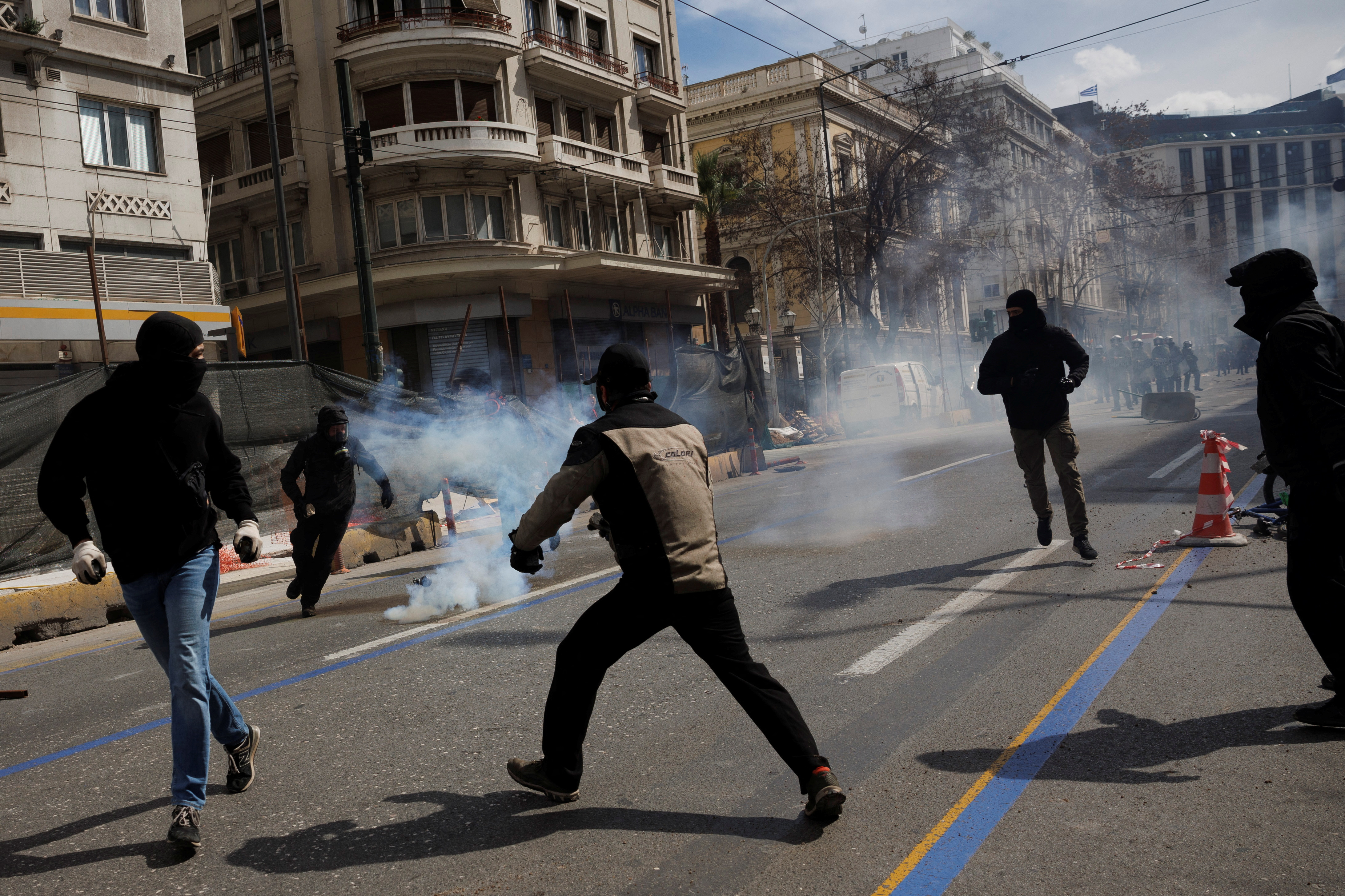 Protesters clash with police during a demonstration after a train crash near the city of Larissa, in Athens