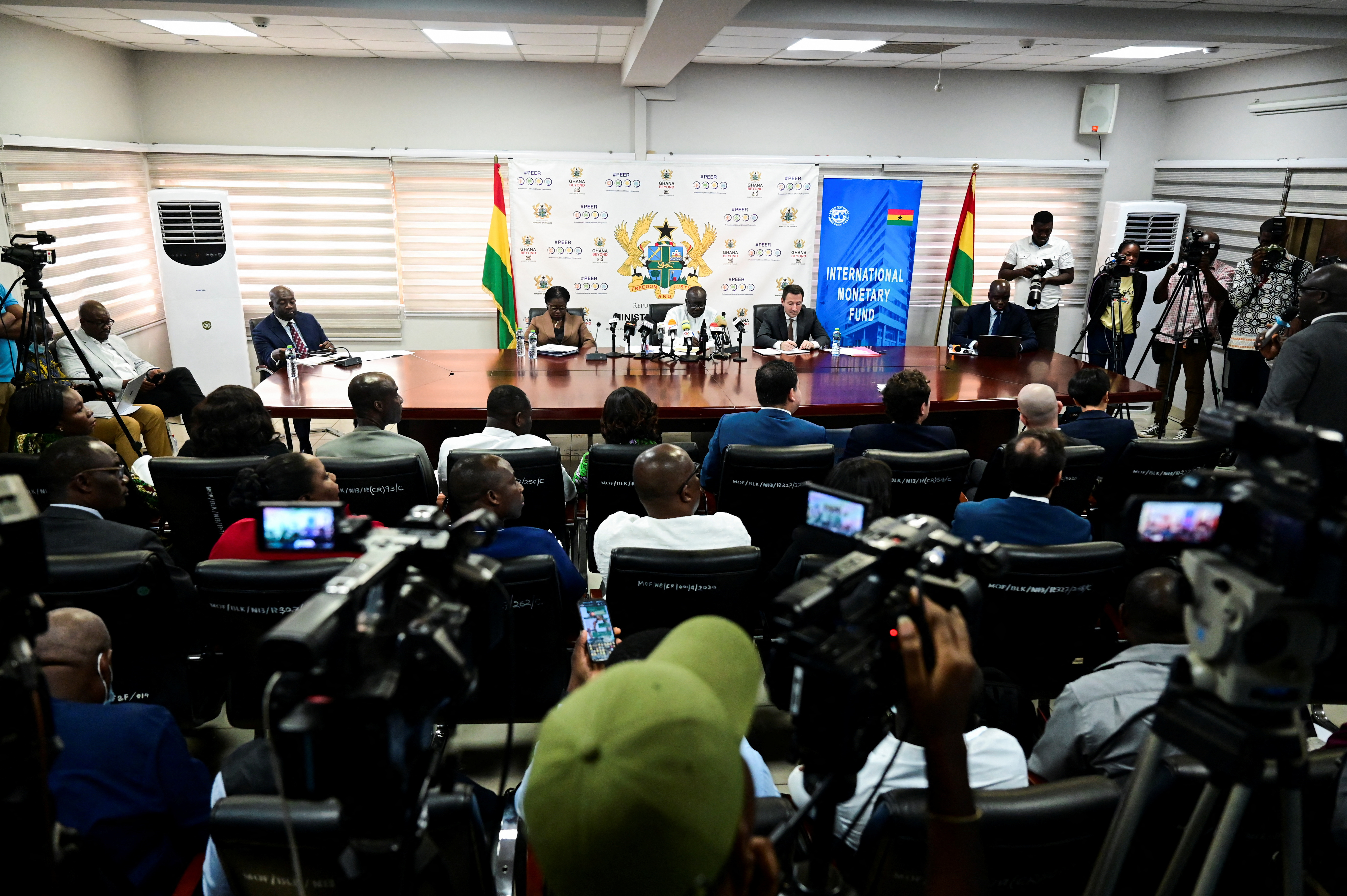 Representatives of Ghana's Finance Ministry, the Central Bank and IMF address the media in Accra