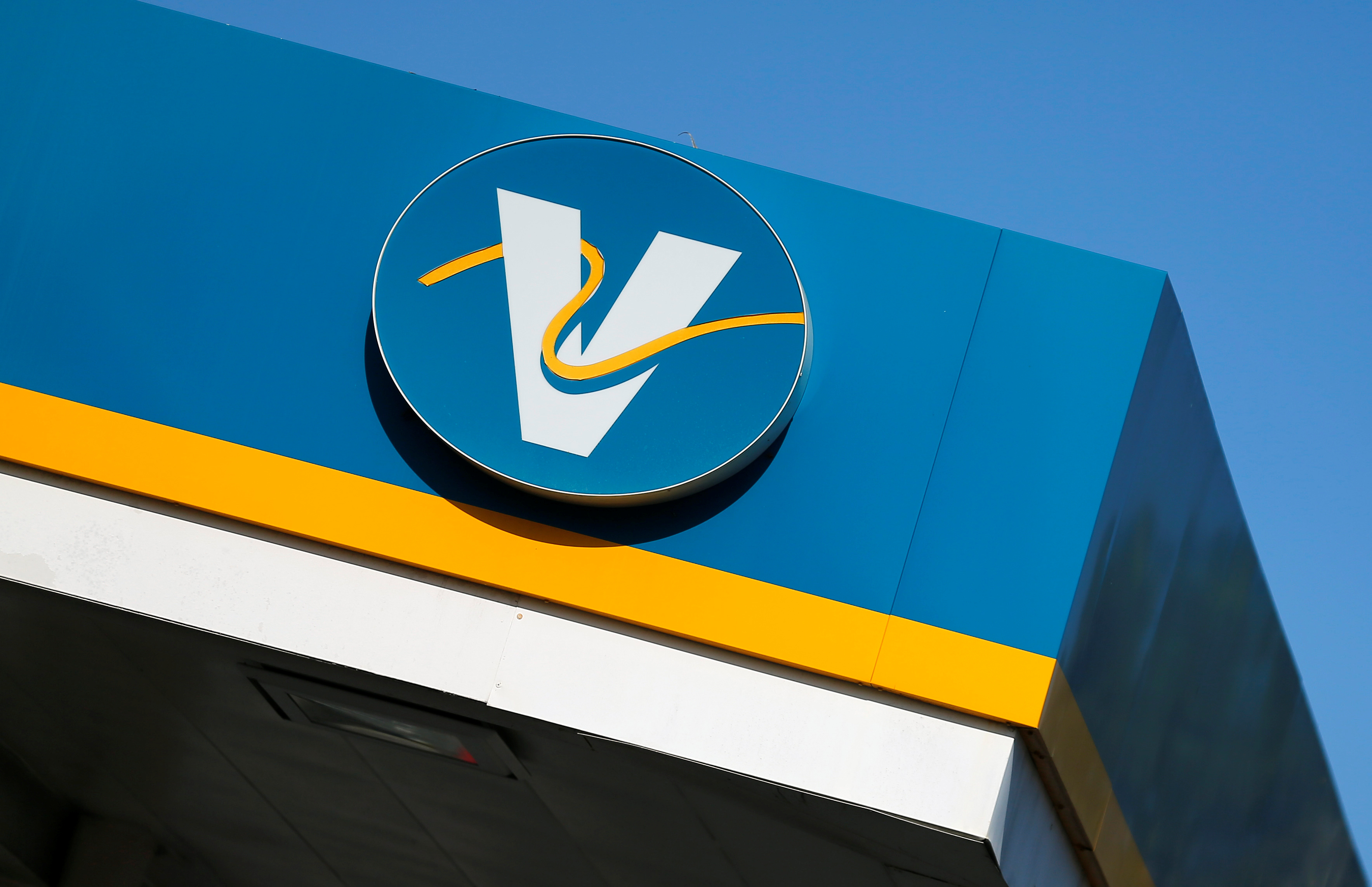 The logo for Valero Energy Corporation is shown at a Valero gas station in Encinitas, California
