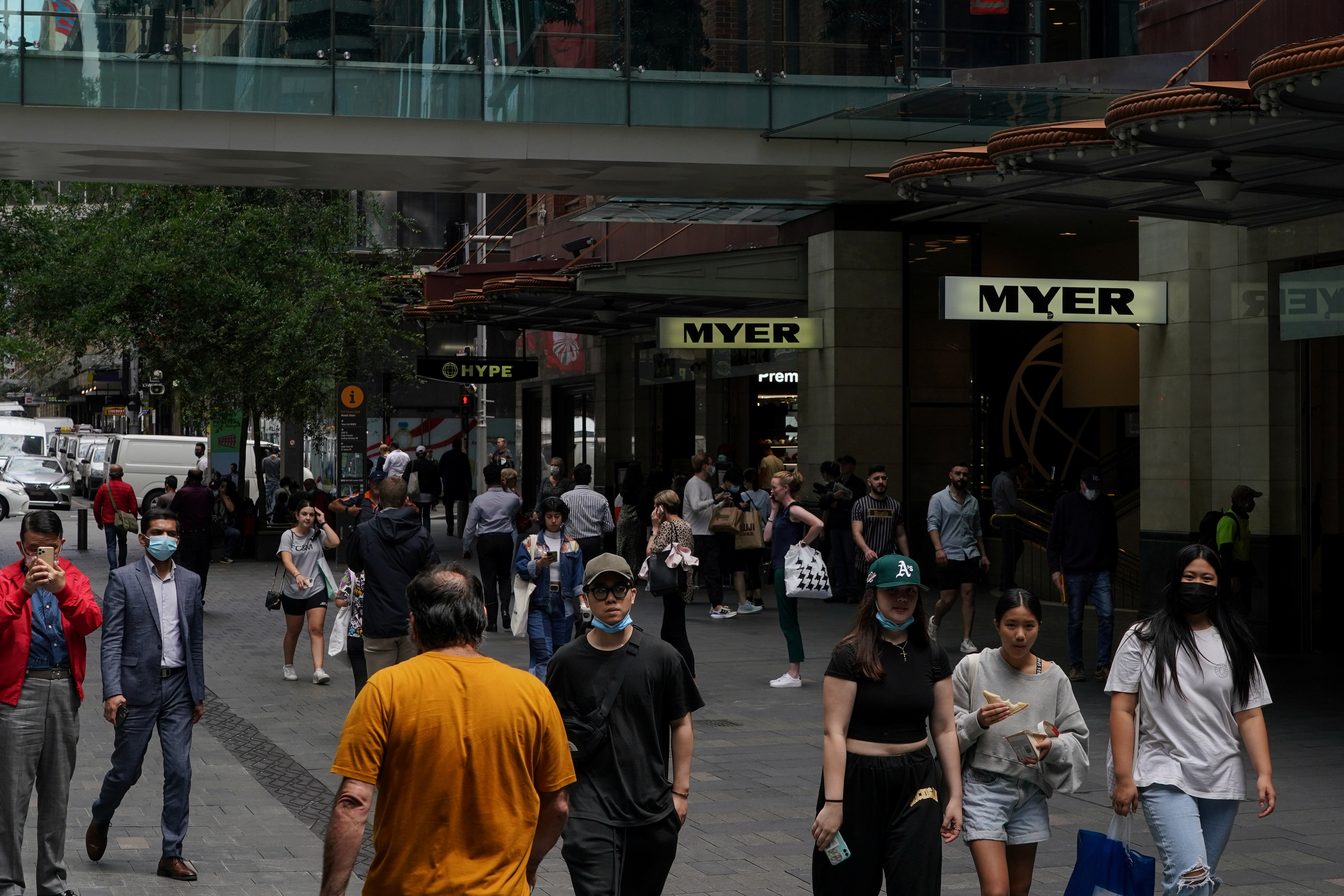 Pedestrians walk through a shopping plaza in the city centre, as the state of New South Wales surpasses the 90 percent double-dose coronavirus disease (COVID-19) vaccination target for its population aged 16 and over, in Sydney, Australia, November 9, 2021.  REUTERS/Loren Elliott