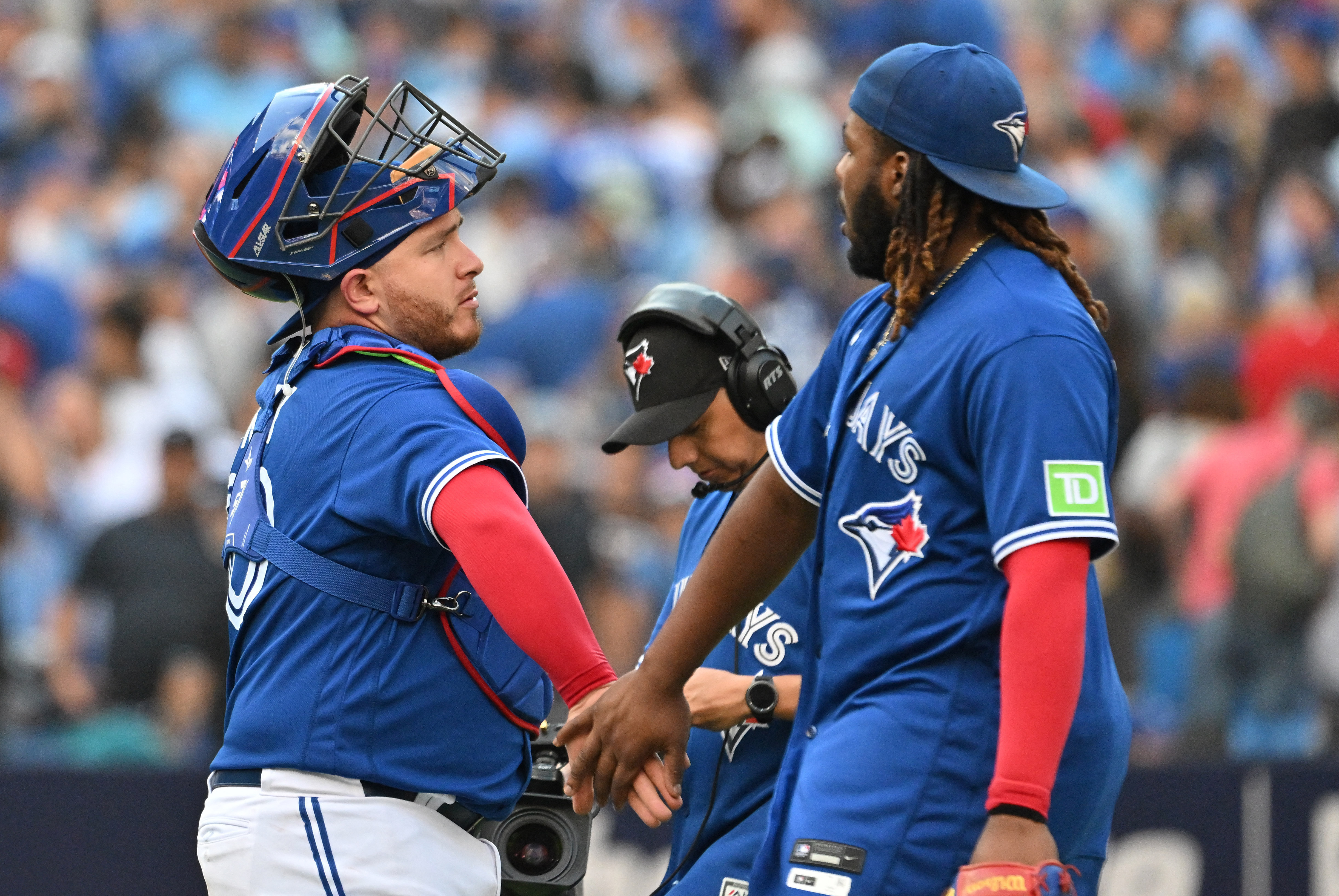 ST. PETERSBURG, FL - MAY 15: Toronto Blue Jays catcher Alejandro Kirk (30)  celebrates his double with his teammates in the dugout during the MLB  regular season game between the Toronto Blue
