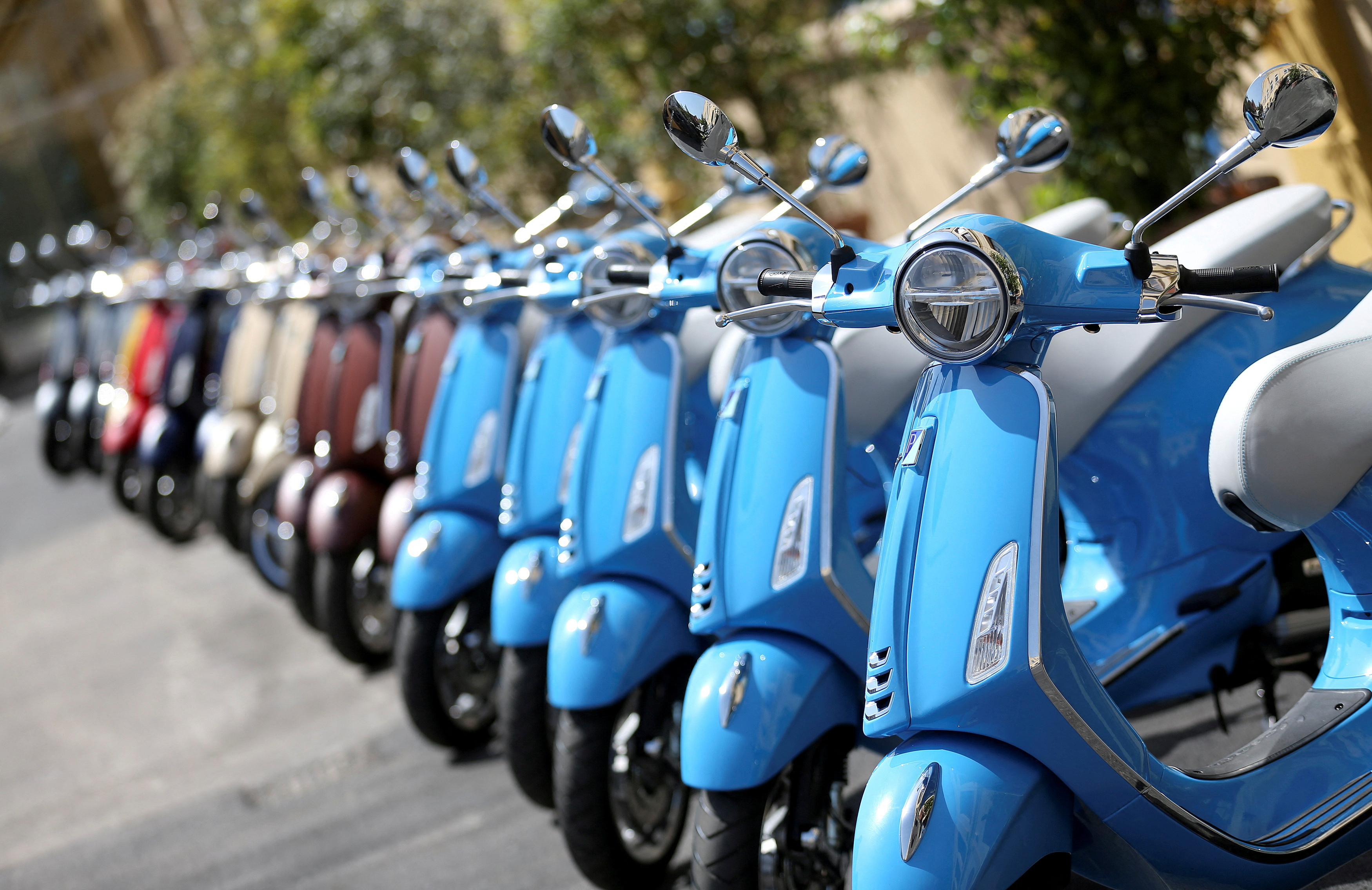 Vespa maker Piaggio's profit nearly halves in first nine months of
