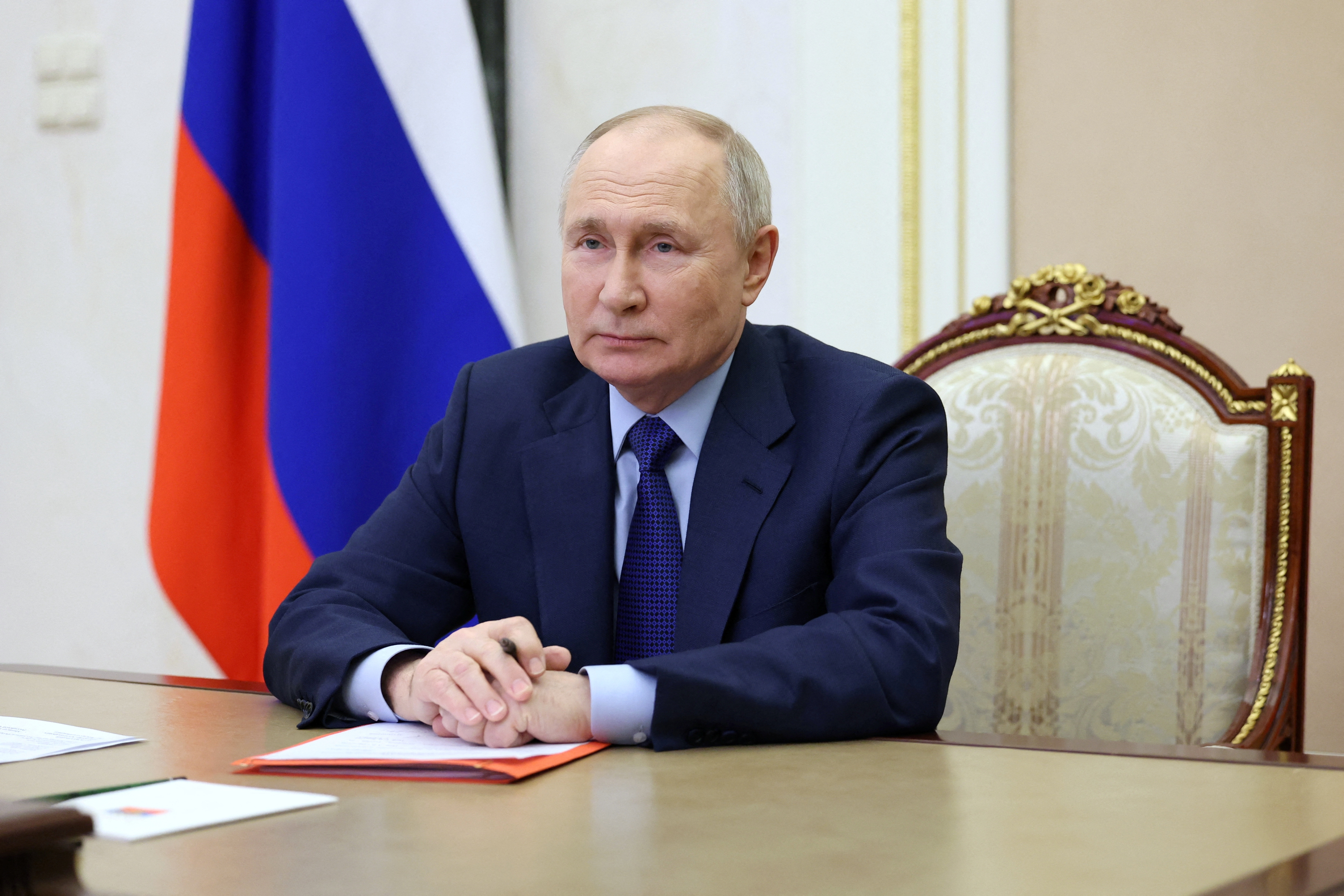 Russian President Putin chairs a meeting with members of the Security Council via video link in Moscow