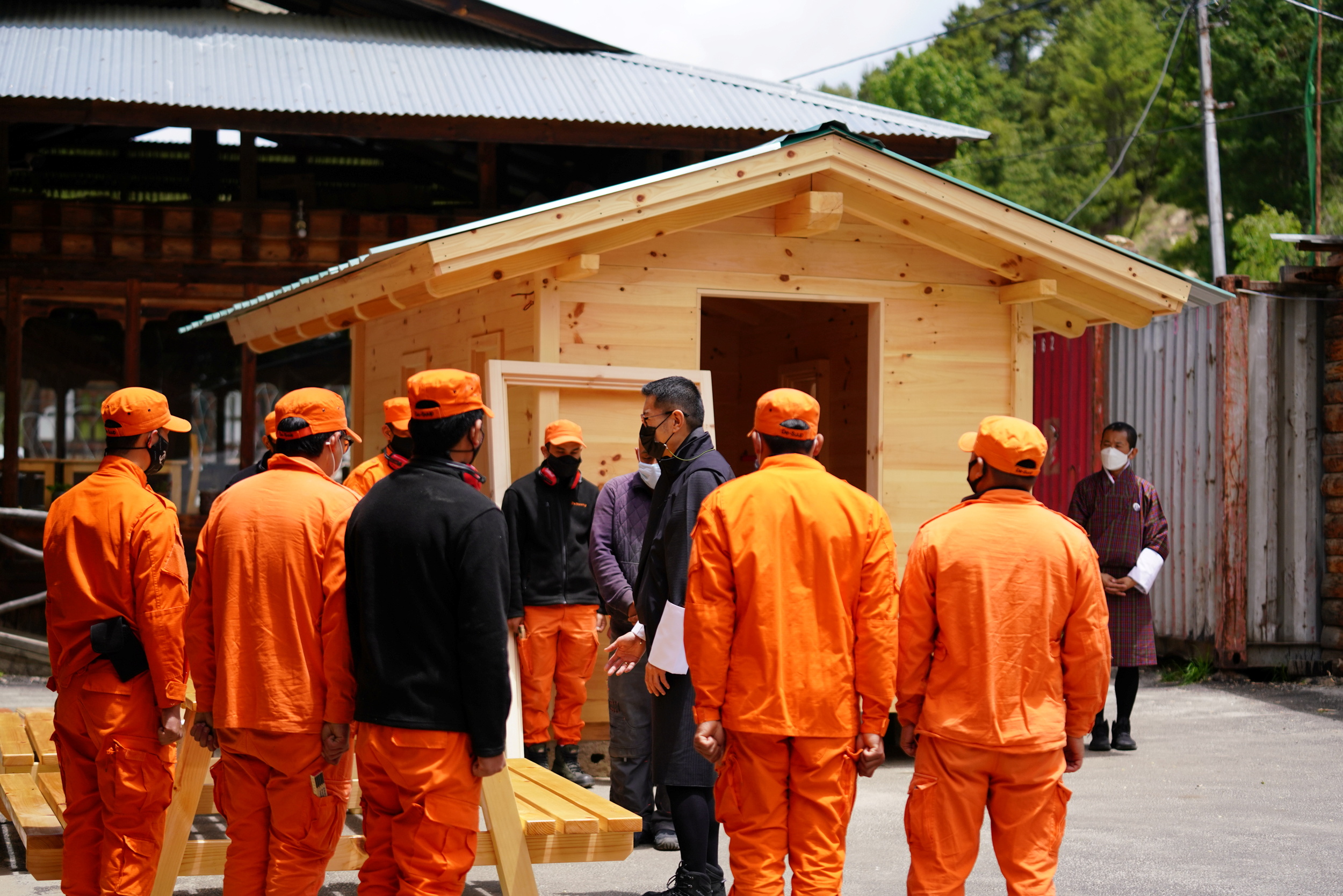 Bhutan's King Jigme Khesar Namgyel Wangchuck visits a group of Desuups training at Carpentry Edelweiss during his visit to remote villages to oversee measures to contain the spread of the coronavirus disease (COVID-19) in Bumthang