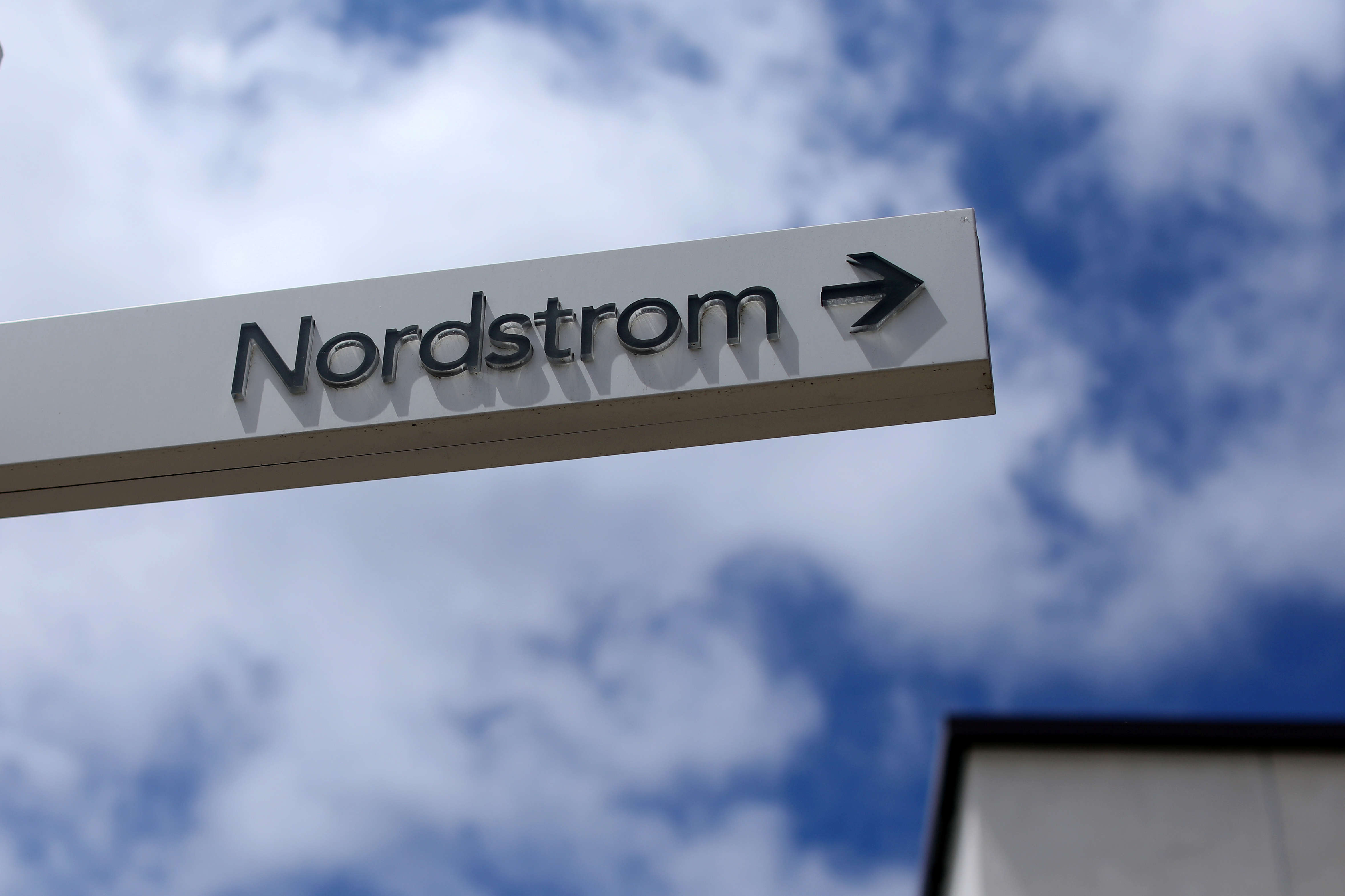 A sign directs shoppers to a Nordstrom store at a shopping mall in La Jolla