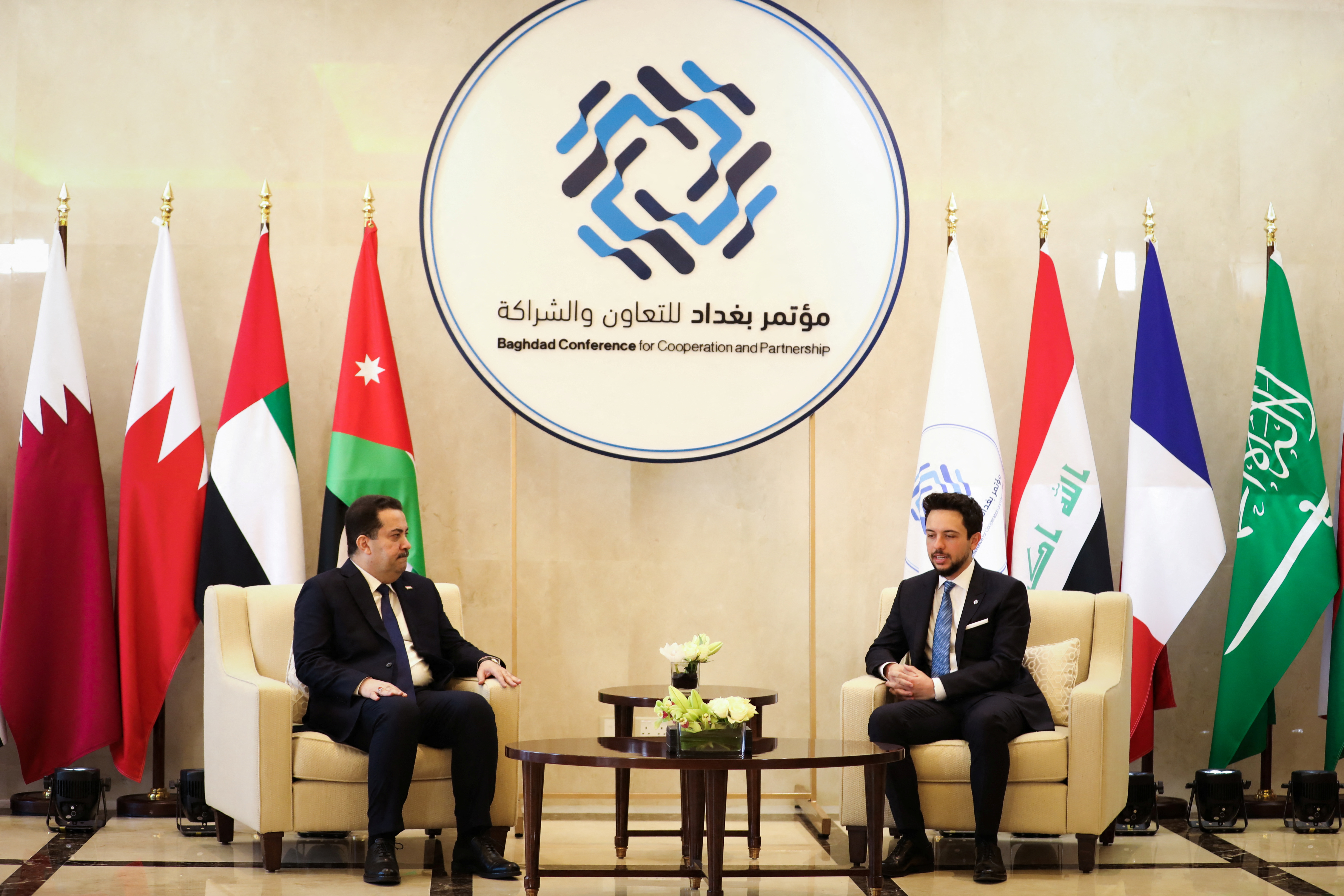 Jordan's Crown Prince Hussein meets with Iraqi Prime Minister Mohammed Shia al-Sudani upon his arrival at Queen Alia International Airport in Amman