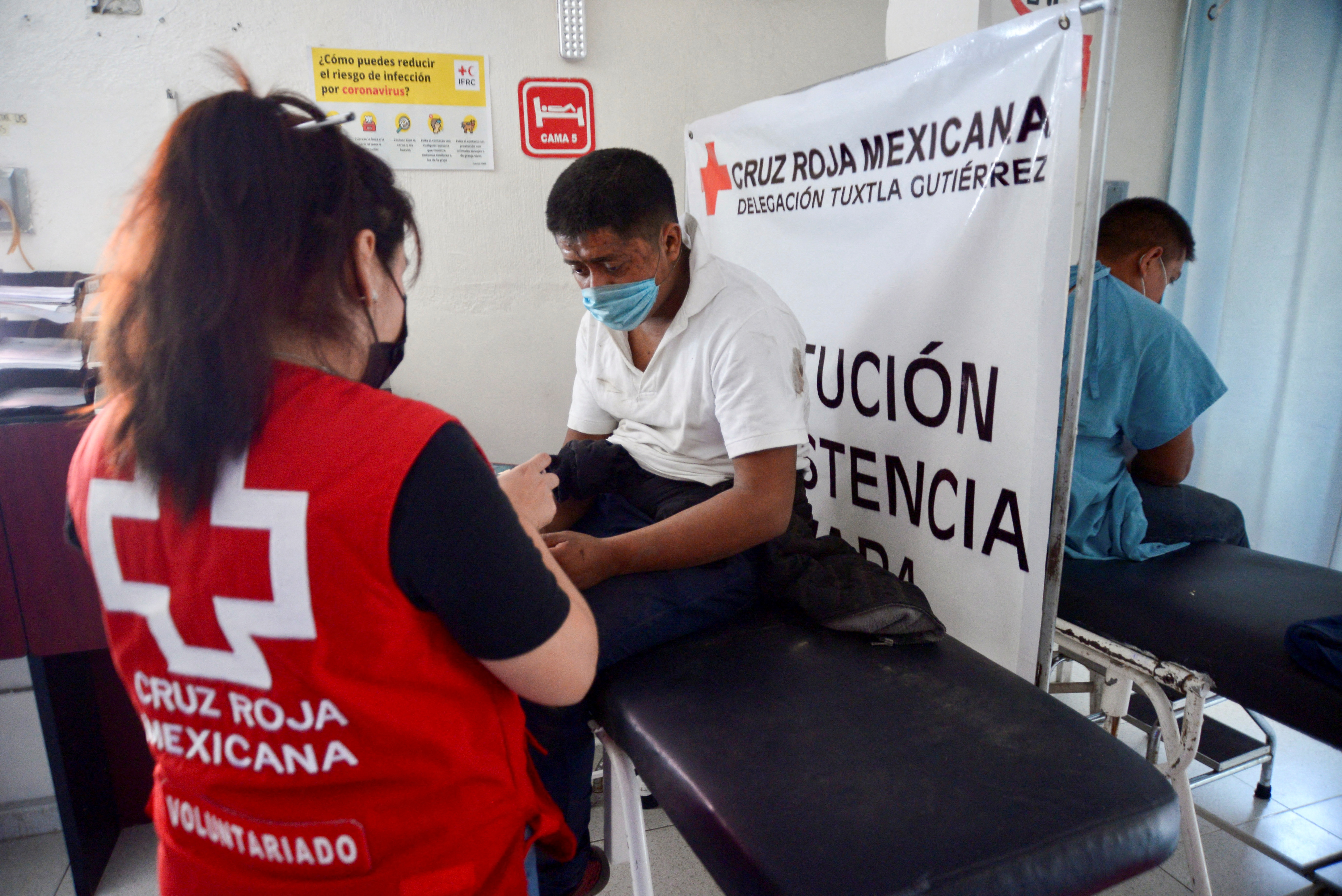 People injured in a truck accident are treated at the Red Cross clinic in Tuxtla Gutierrez