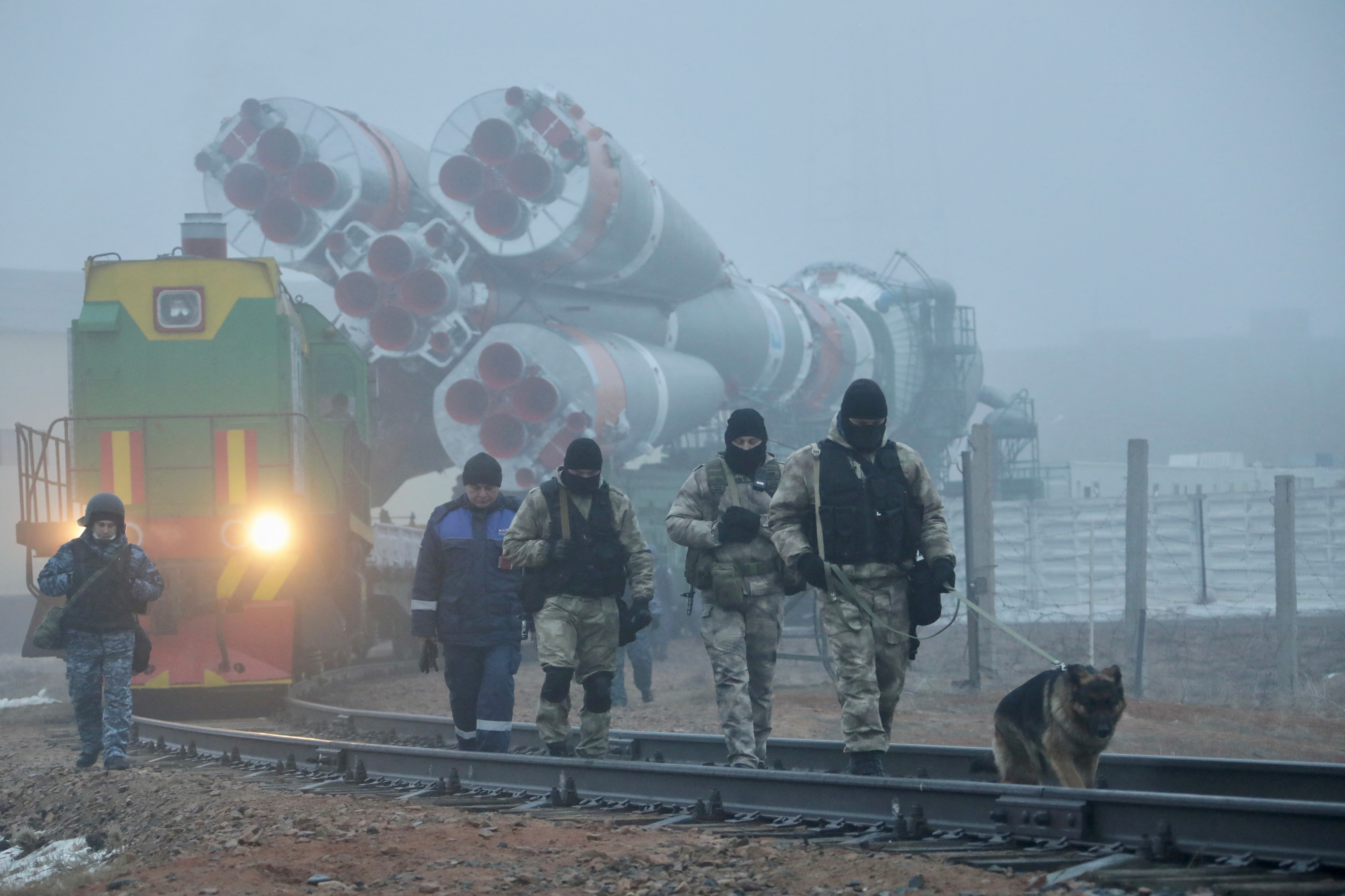 A Soyuz rocket booster with satellites of British firm OneWeb is transported to a launchpad at the Baikonur Cosmodrome