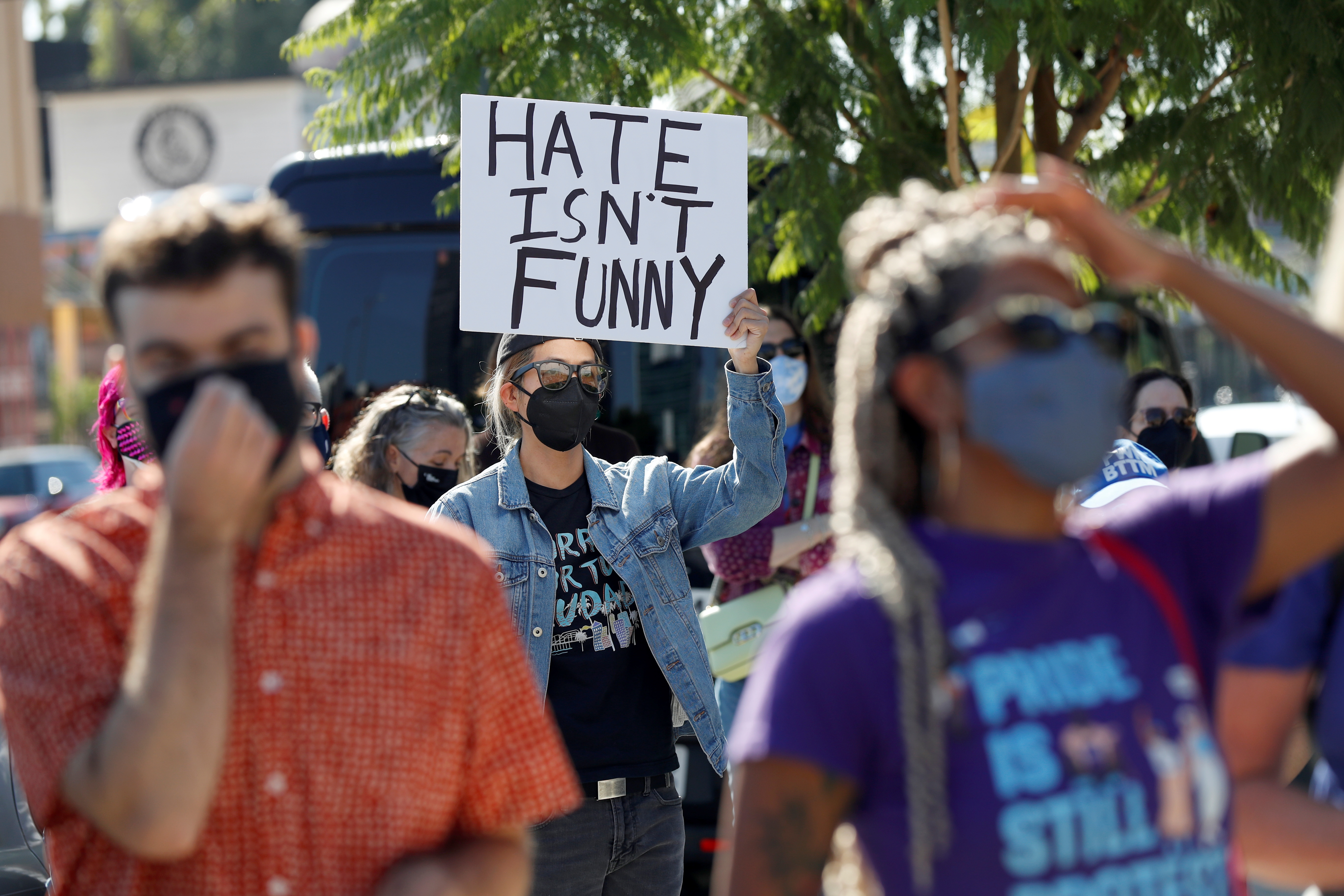 People attend a rally in support of the Netflix transgender employee walkout ?Stand Up in Solidarity? to protest the streaming of comedian Dave Chappelle?s new comedy special, in Los Angeles, California, U.S. October 20 2021. REUTERS/Mario Anzuoni