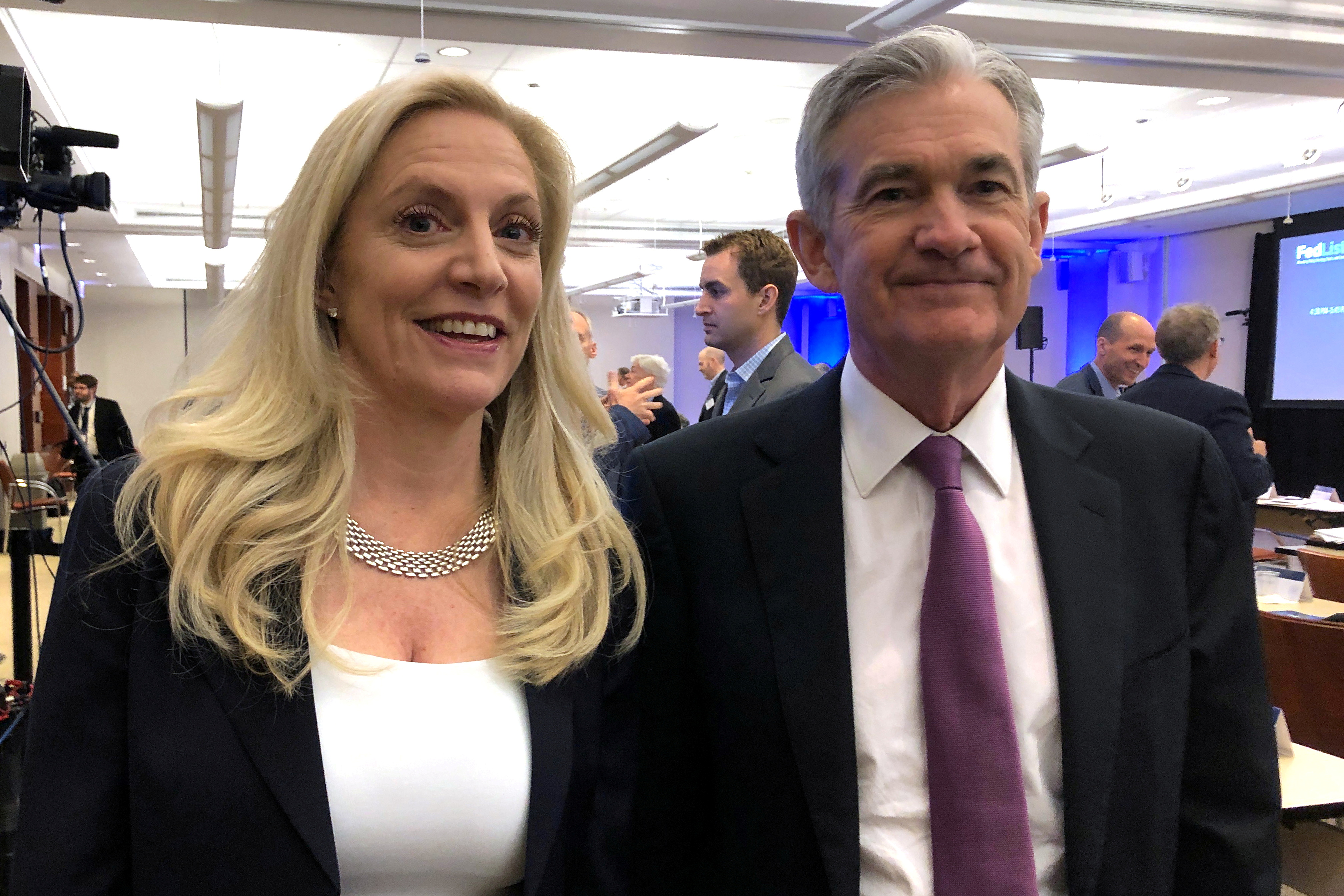Federal Reserve Chairman Jerome Powell poses for photos with Fed Governor Lael Brainard at the Federal Reserve Bank of Chicago