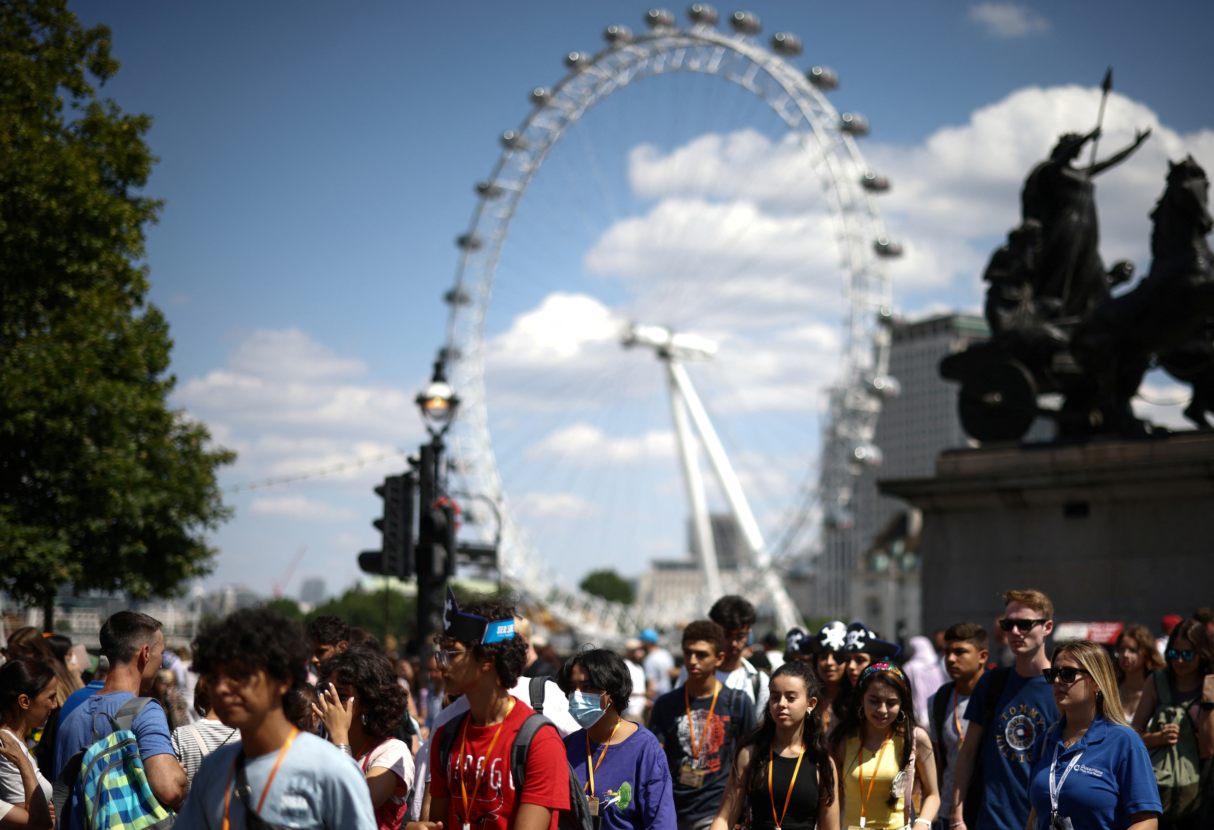 People walk over Westminster Bridge in London