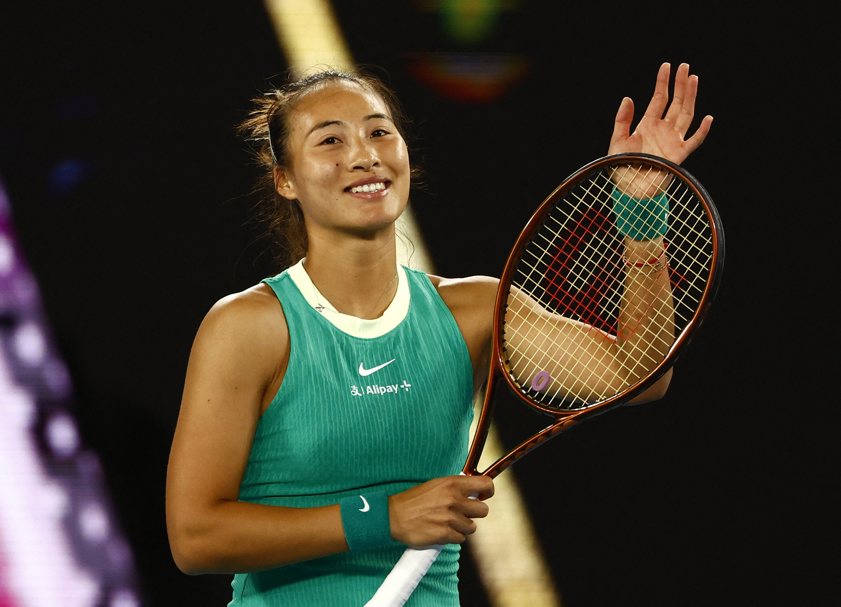 Zheng glides past Dodin to book Melbourne quarter-final spot | Reuters