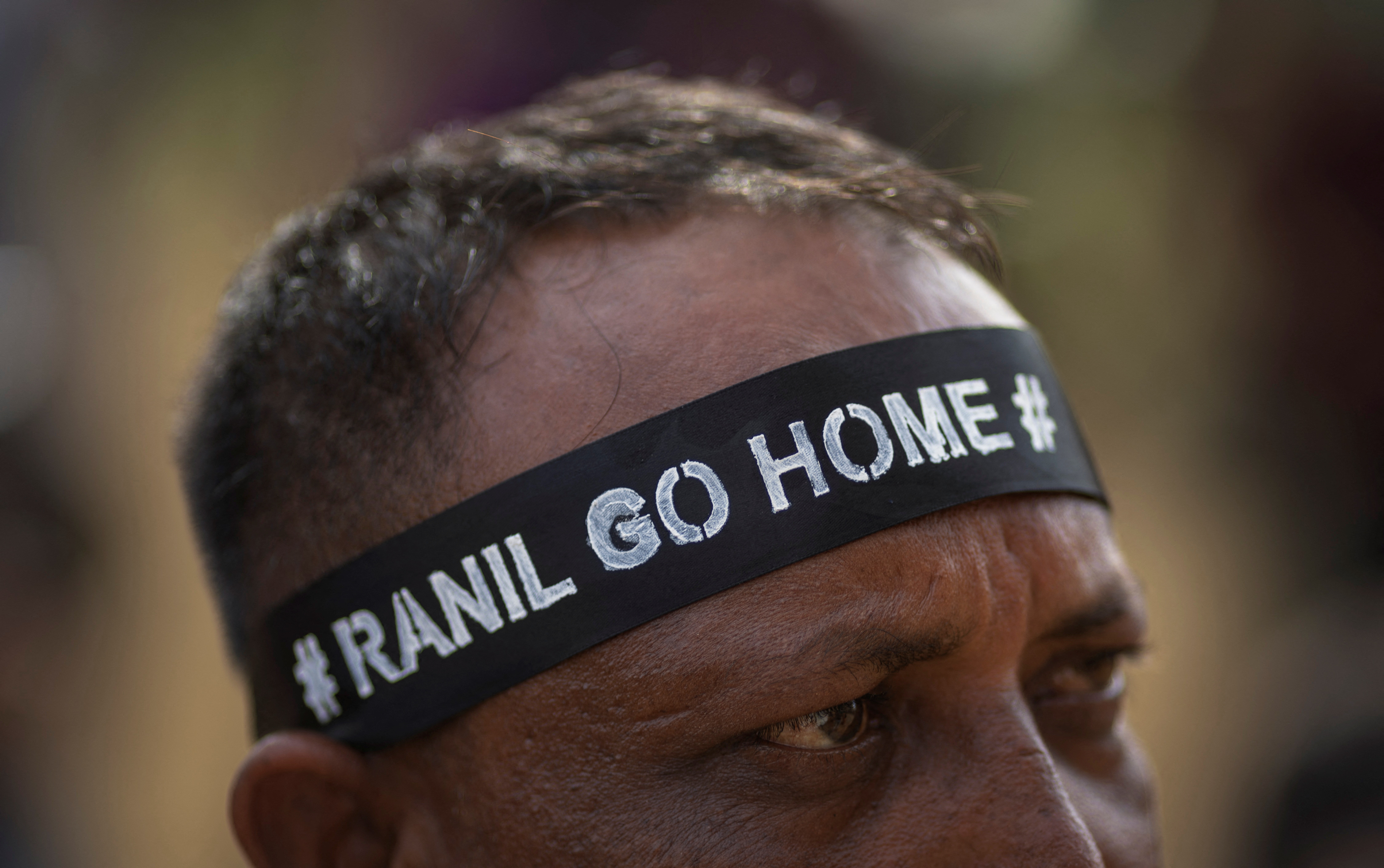 Protestors attend a protest against Sri Lanka's newly elected President Ranil Wickremesinghe, in Colombo