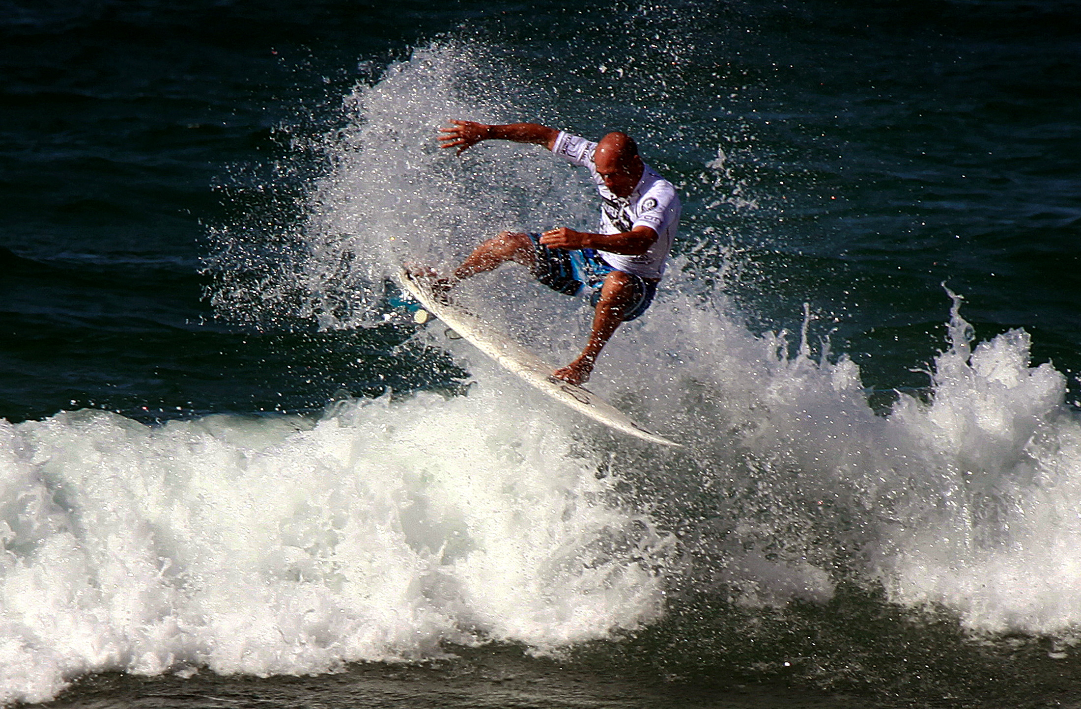 Kelly Slater rides a wave during a promotional event at Sydney's Manly Beach