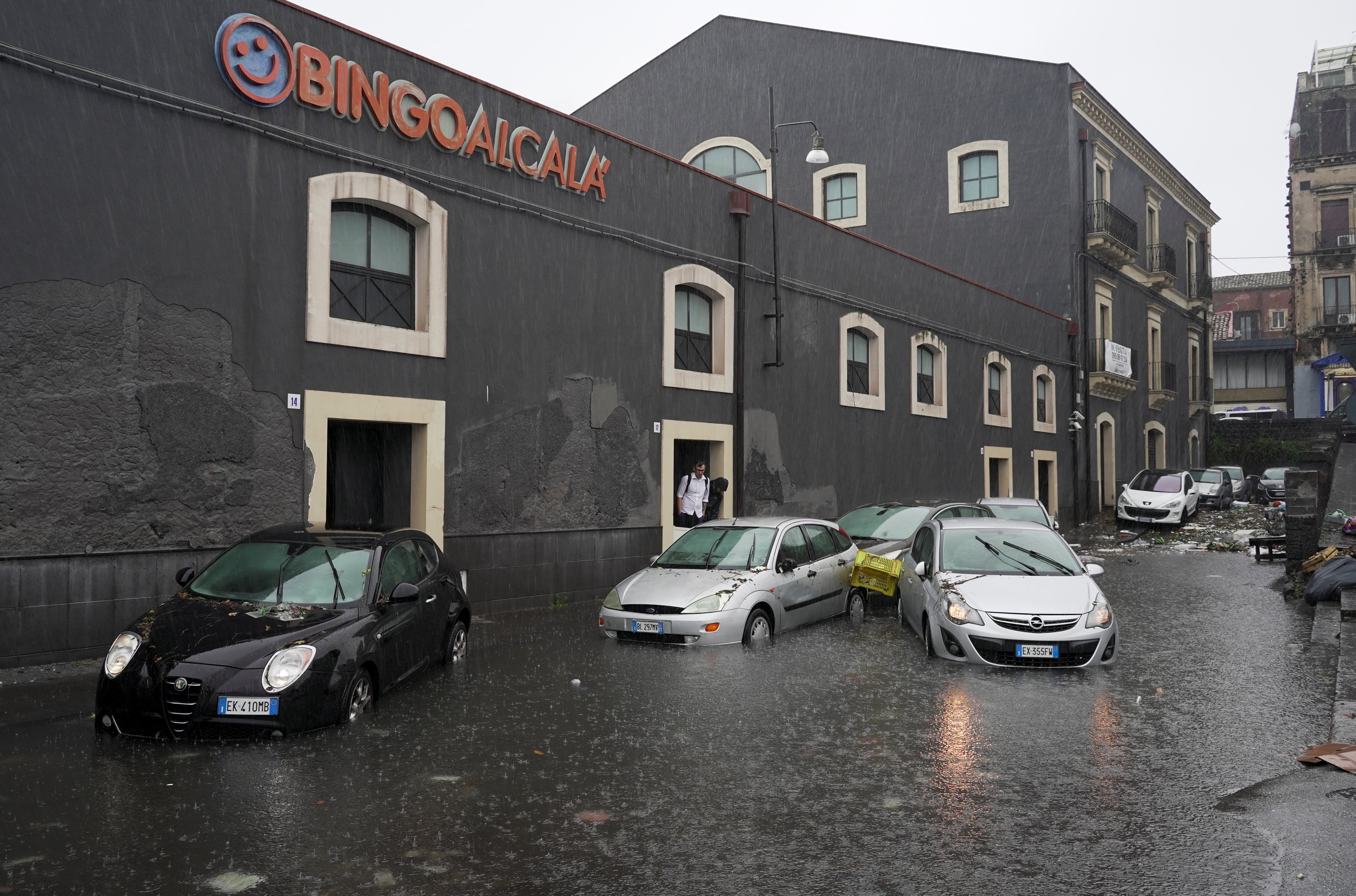 Cars are submerged on a flooded street during heavy rainfall on the island of Sicily, in Catania, Italy, October 26, 2021. REUTERS/Antonio Parrinello