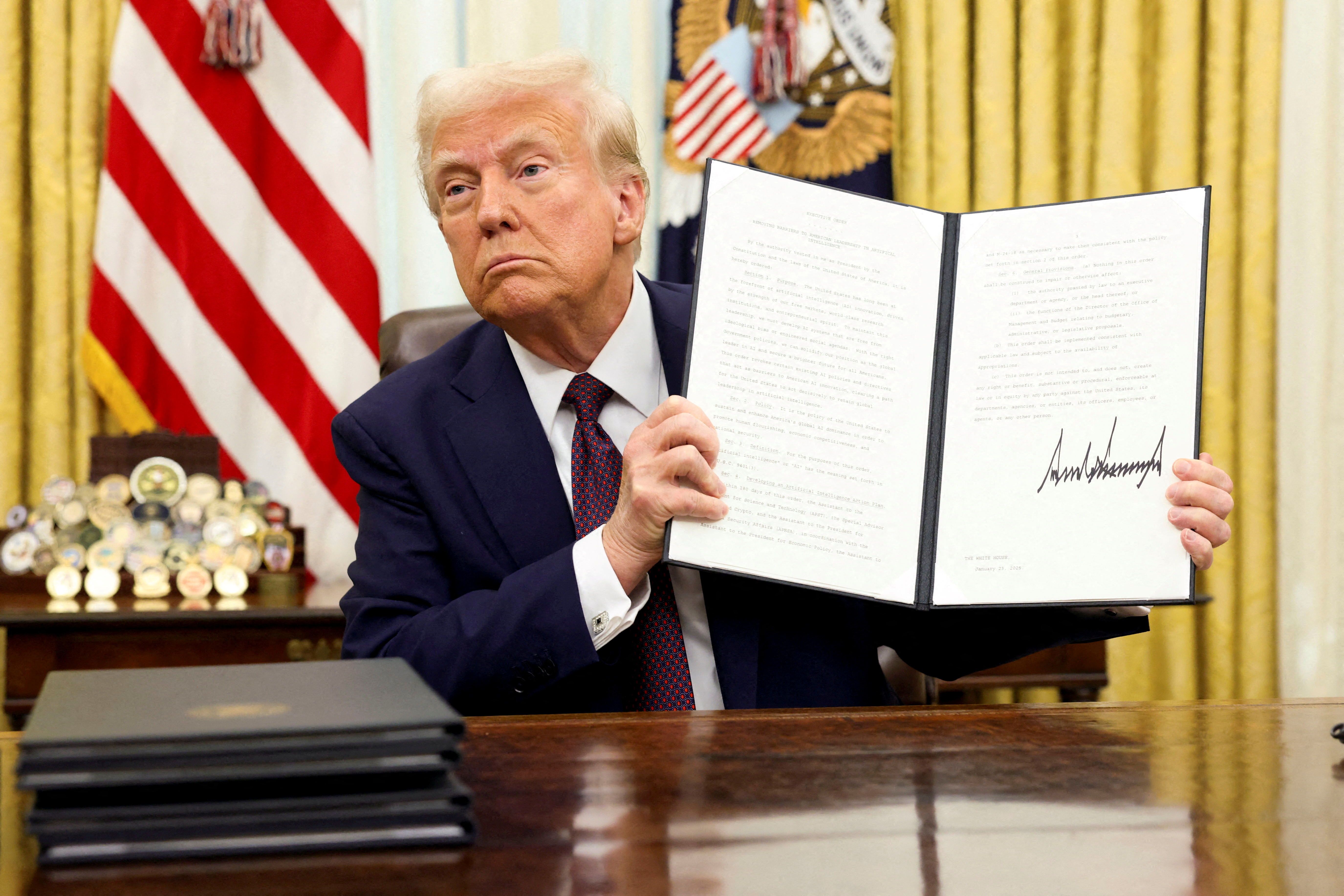 Trump orders crypto working group to draft new regulations, explore  national stockpile | Reuters