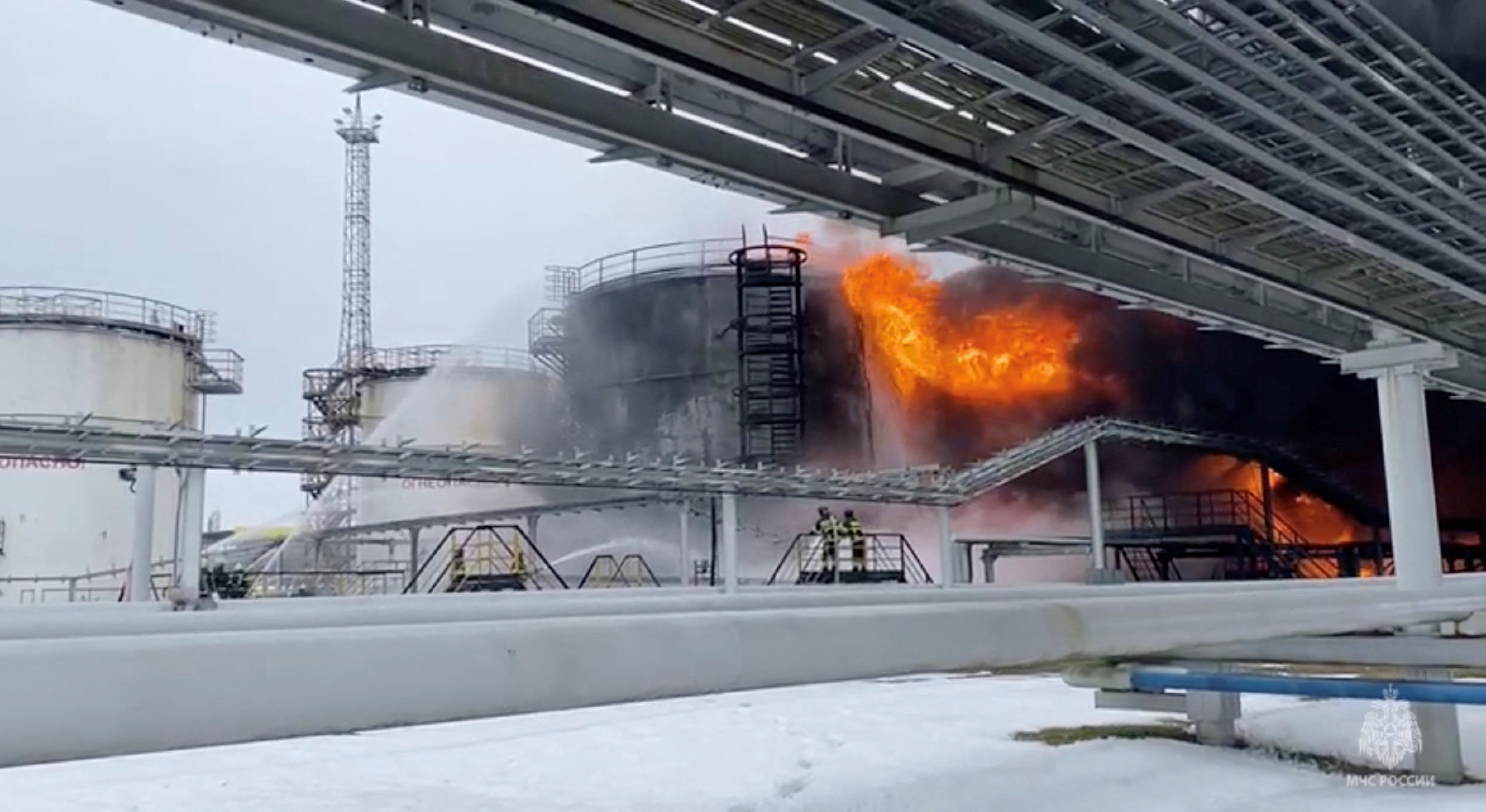 Firefighters extinguish oil tanks at a storage facility in Klintsy