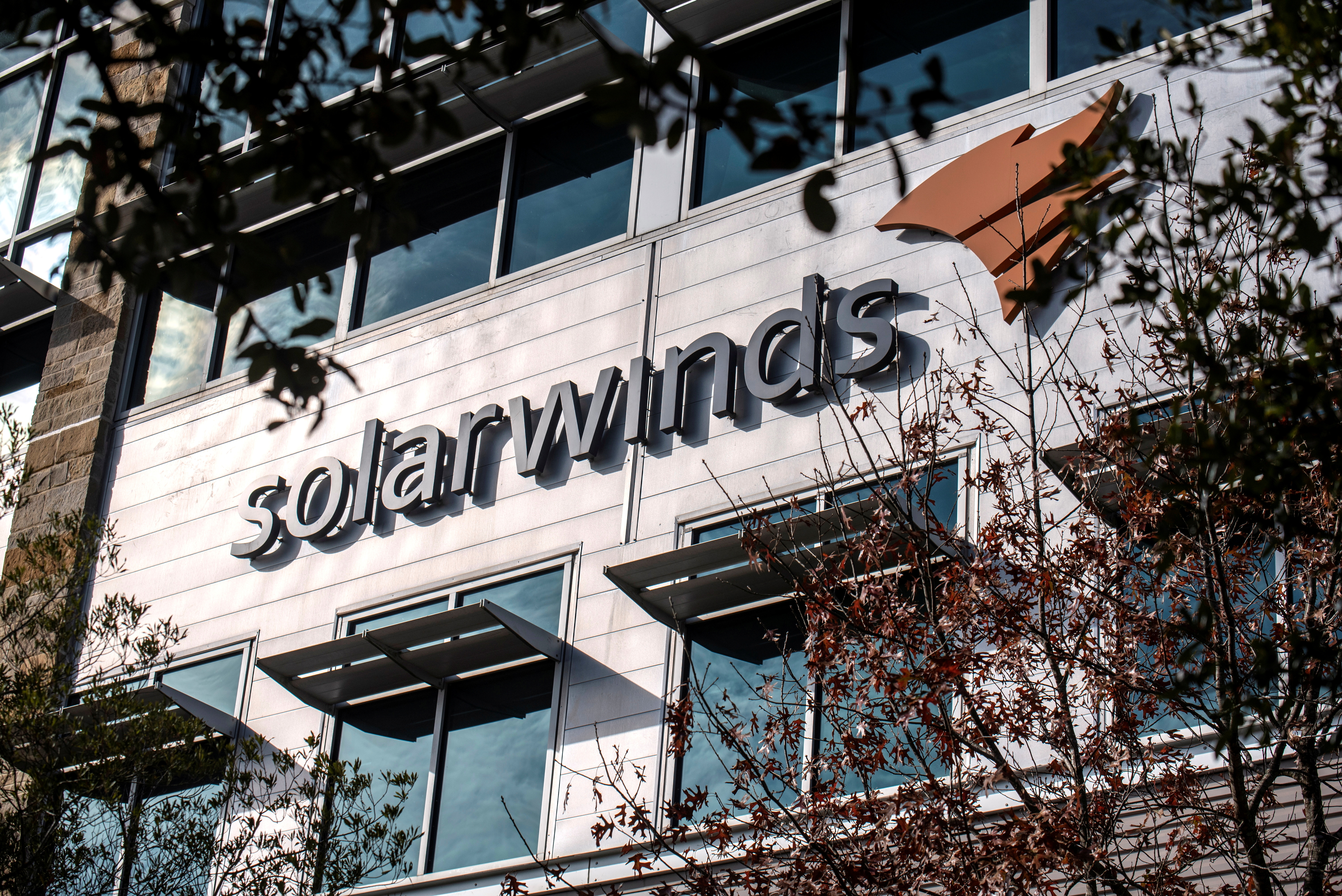 The SolarWinds logo is seen outside its headquarters in Austin, Texas, U.S., December 18, 2020. REUTERS/Sergio Flores/File Photo