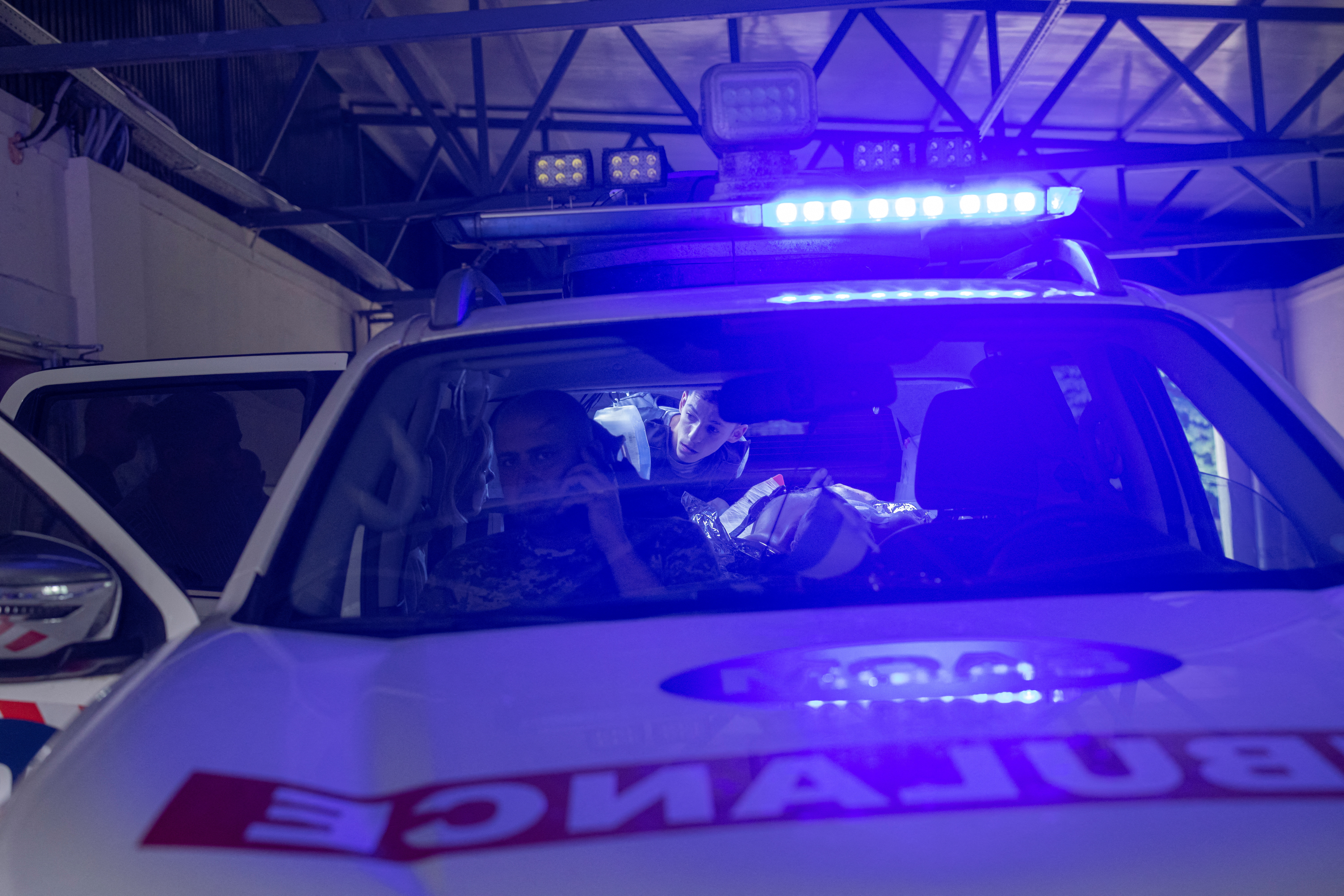 Injured man lies in emergency vehicle in Kramatorsk