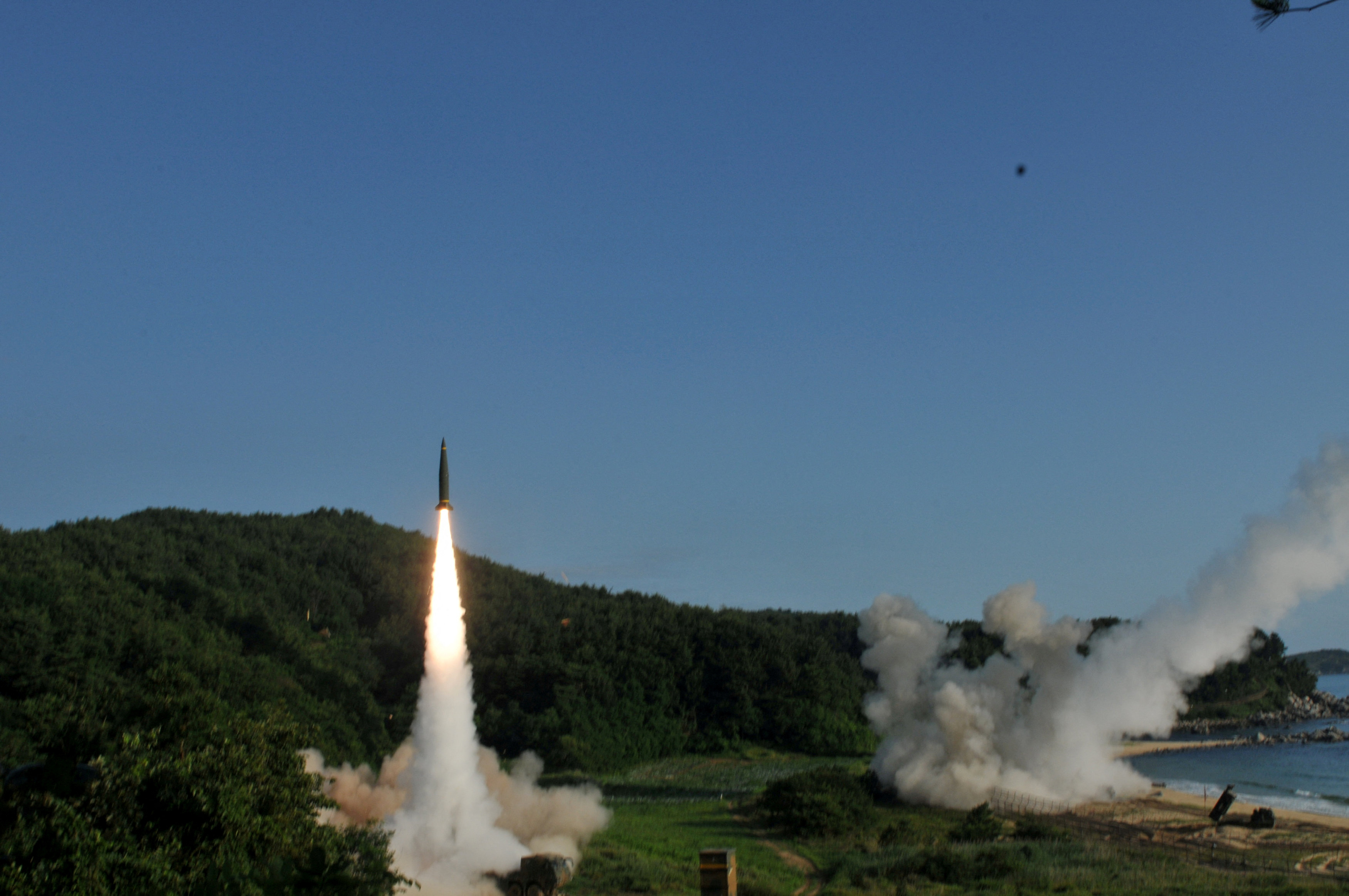 Handout of United States and South Korean troops utilizing the Army Tactical Missile System (ATACMS) and South Korea's Hyunmoo Missile II, fire missiles into the waters of the East Sea, off South Korea