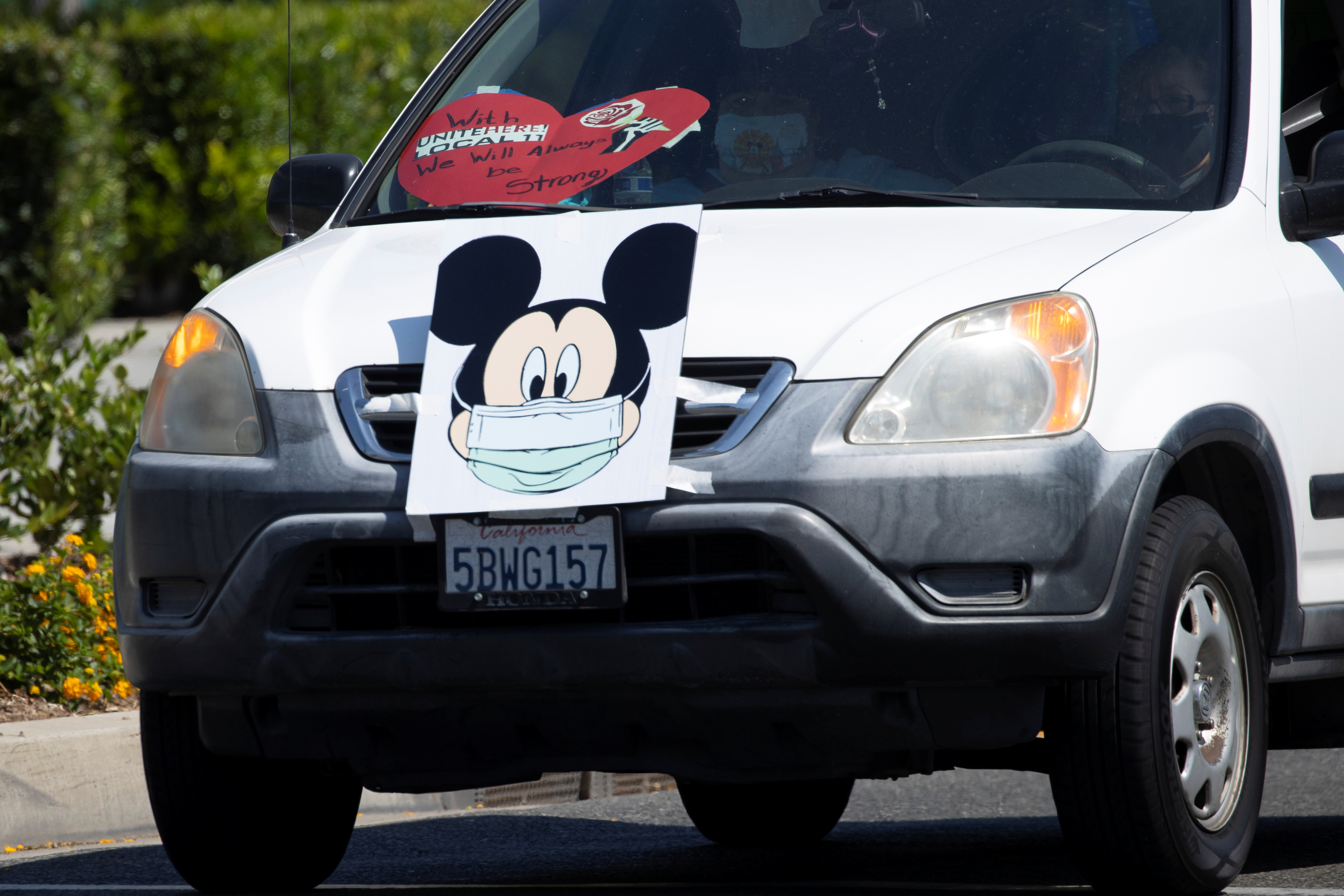 Coalition of Resort Labor Unions representing Disney cast members stage a car caravan outside Disneyland California, calling for higher safety standards for Disneyland to reopen during the global outbreak of the coronavirus disease (COVID-19) in Anaheim, California, U.S., June 27, 2020. REUTERS/Mike Blake