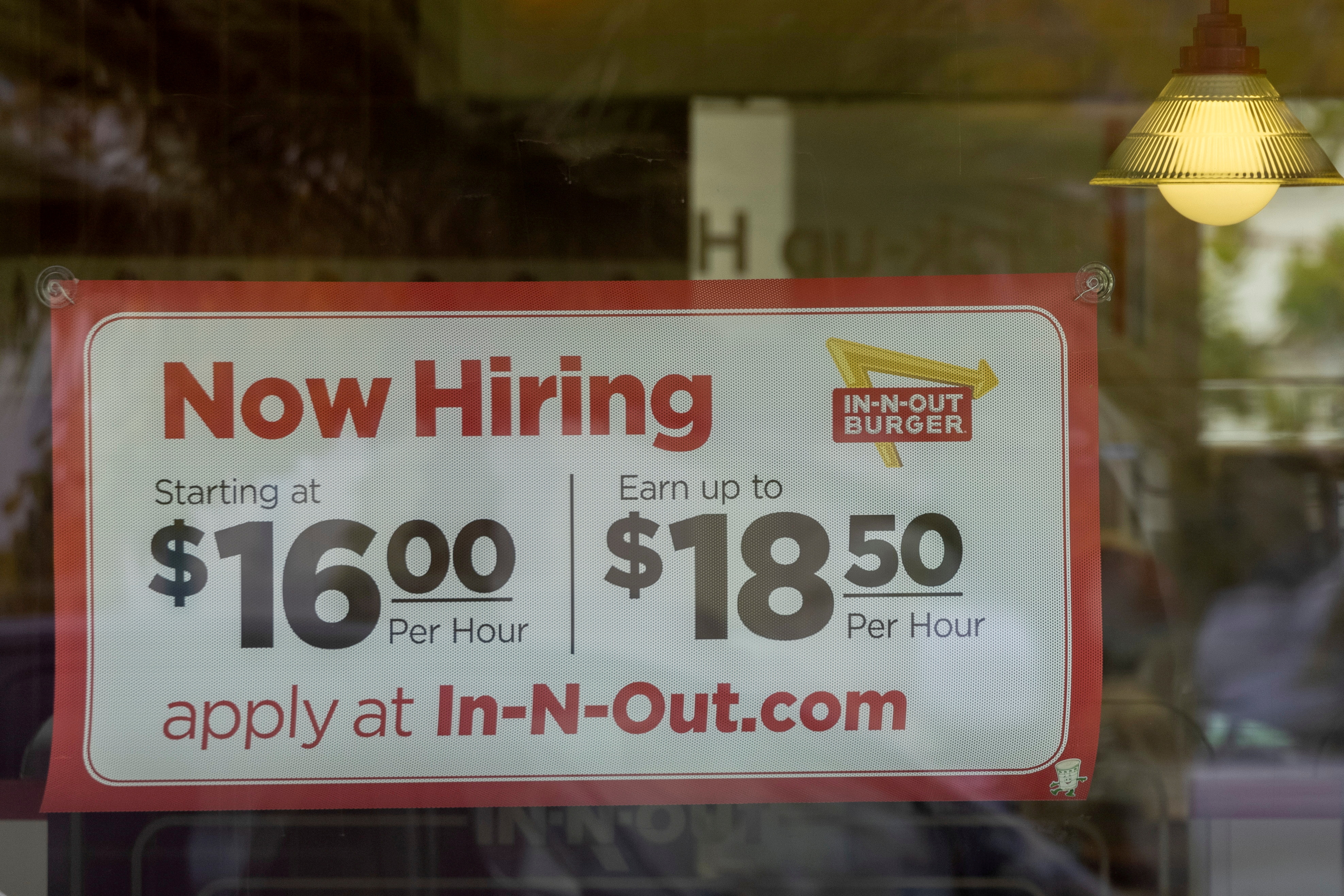 An In-N-Out Burger advertises for workers at their restaurants location in Encinitas, California, U.S., May 10, 2021. REUTERS/Mike Blake/File Photo/File Photo