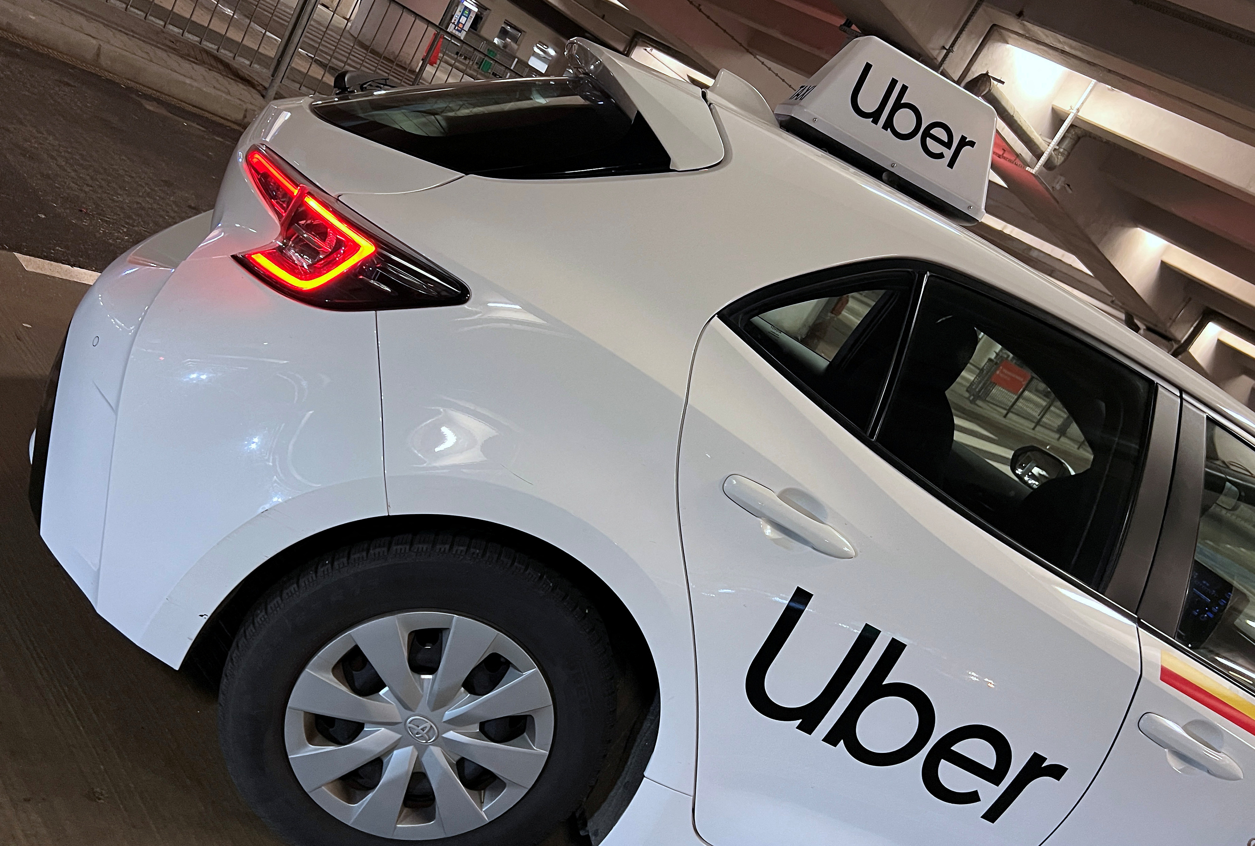 Uber branding is seen on private hire vehicle at Chopin Airport in Warsaw