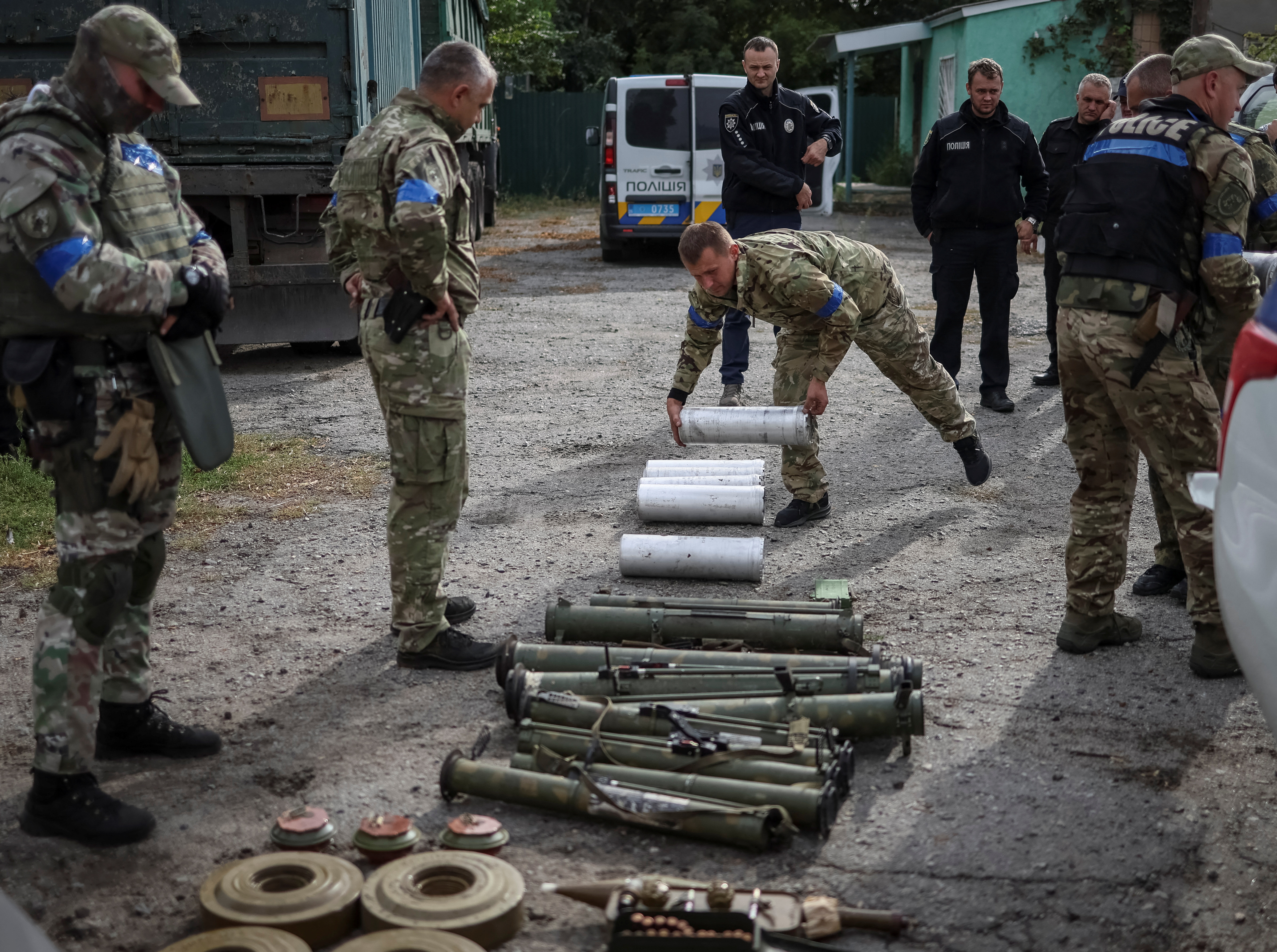 Ukrainian soldiers burn Russian flag in Vovchansk as they regain territory  